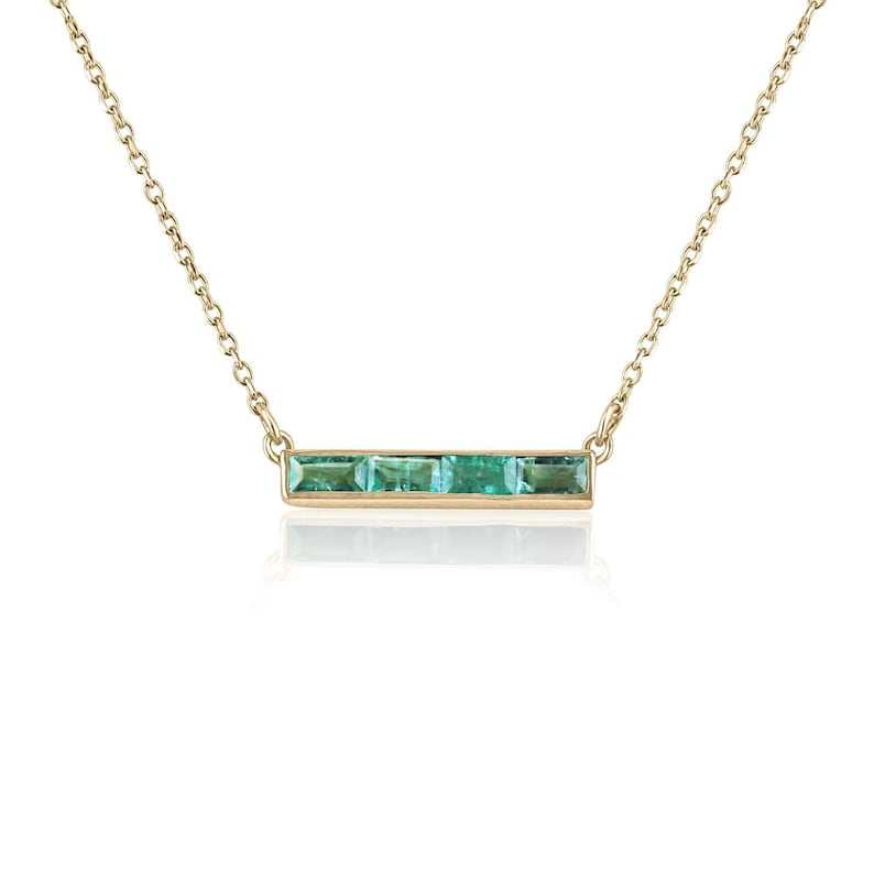 0.60tcw baguette cut emerald necklace with 14K gold bezel setting on 18-inch cable chain