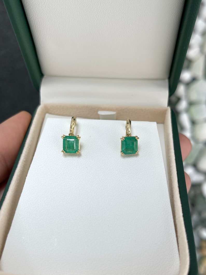 Colombian Emerald 2.80tcw Asscher cut knife-edge huggie dangle earrings in 14K gold with natural emeralds and elegant design