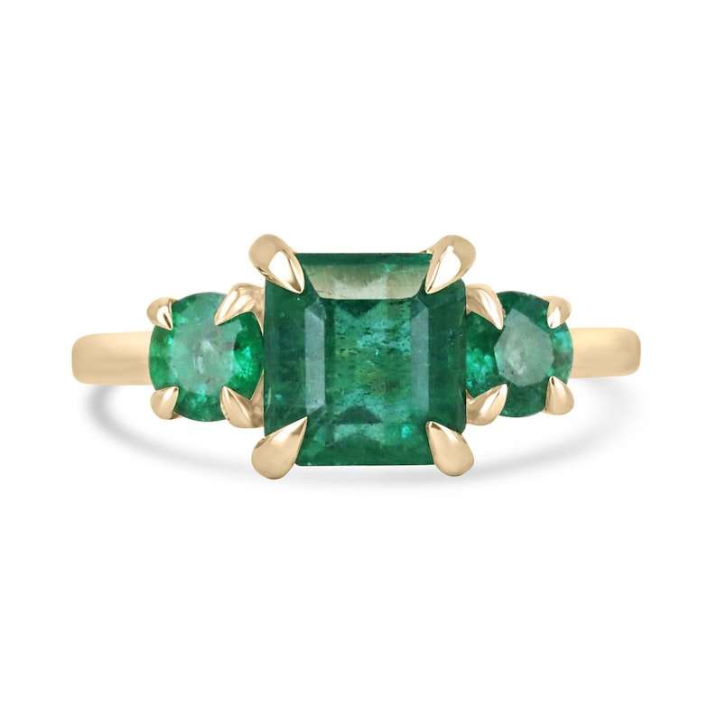 14K yellow gold ring with natural lush green Asscher cut and round cut emeralds in three stone prong setting
