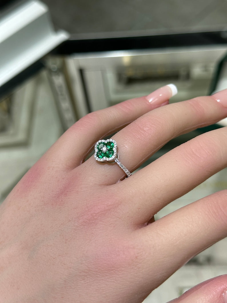 Floral Styled 14K White Gold Ring with Brilliant Round Cut Diamonds and Oval Emerald