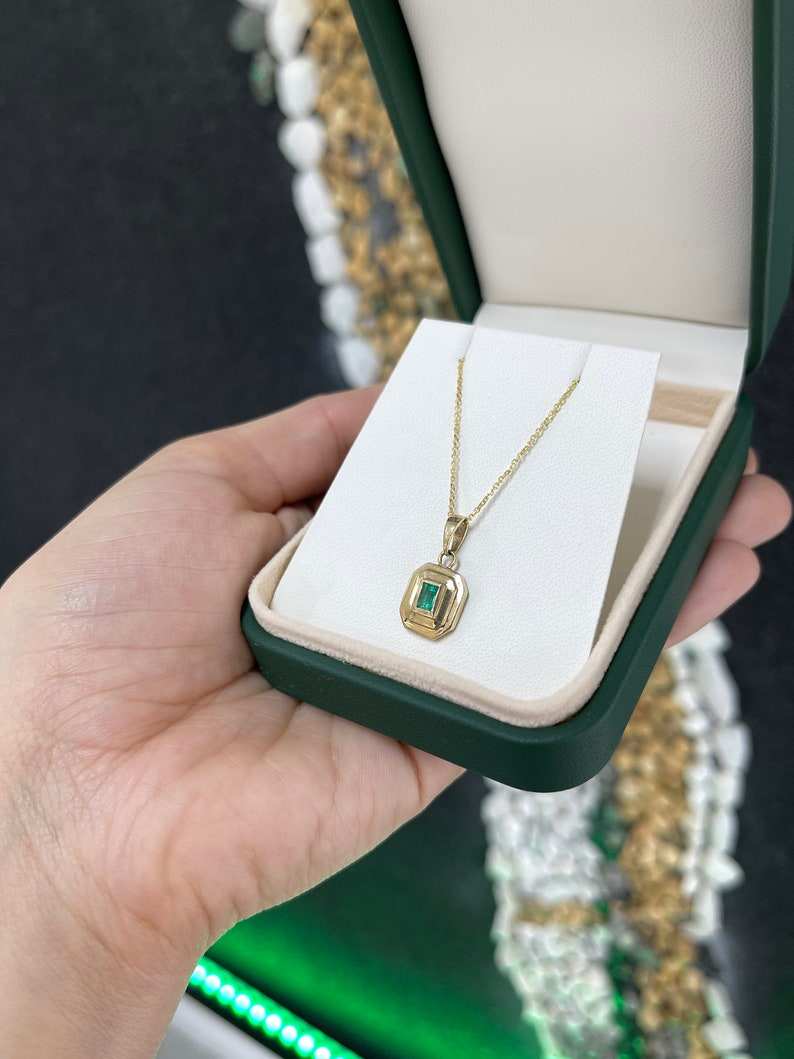 14K gold emerald cut pendant necklace with a lush green natural North to South Colombian emerald, bezel set, unisex jewelry.