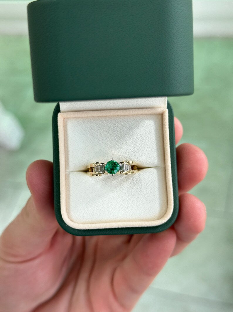 14K gold engagement ring with 1.25tcw Colombian emerald center stone and diamond baguette accents, six-prong setting.