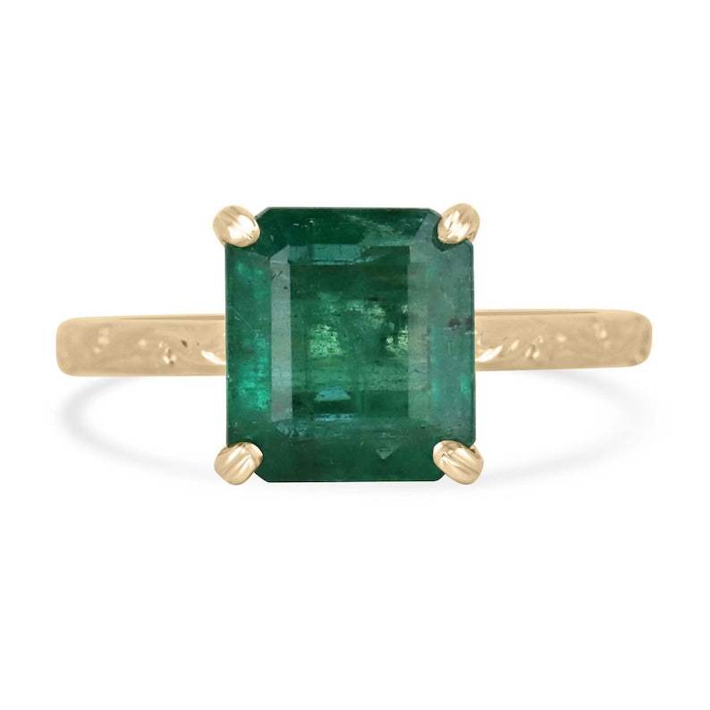 2.89ct Asscher cut medium dark green emerald solitaire ring in 14K yellow gold with floral carved band