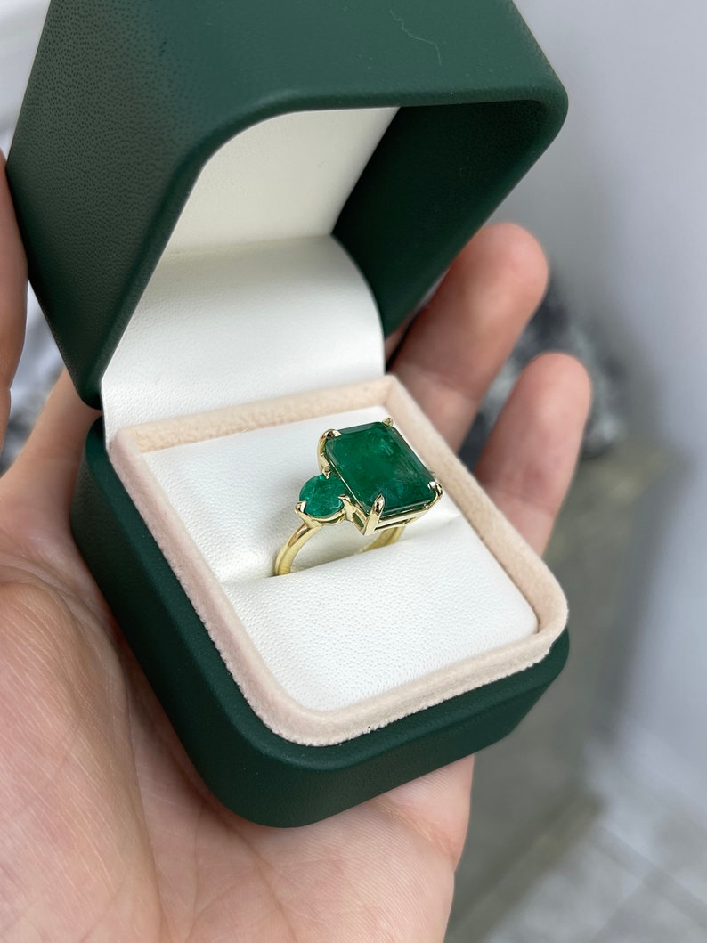Charming 18K Yellow Gold Ring Featuring 9.21tcw of Emeralds in Trilogy Design