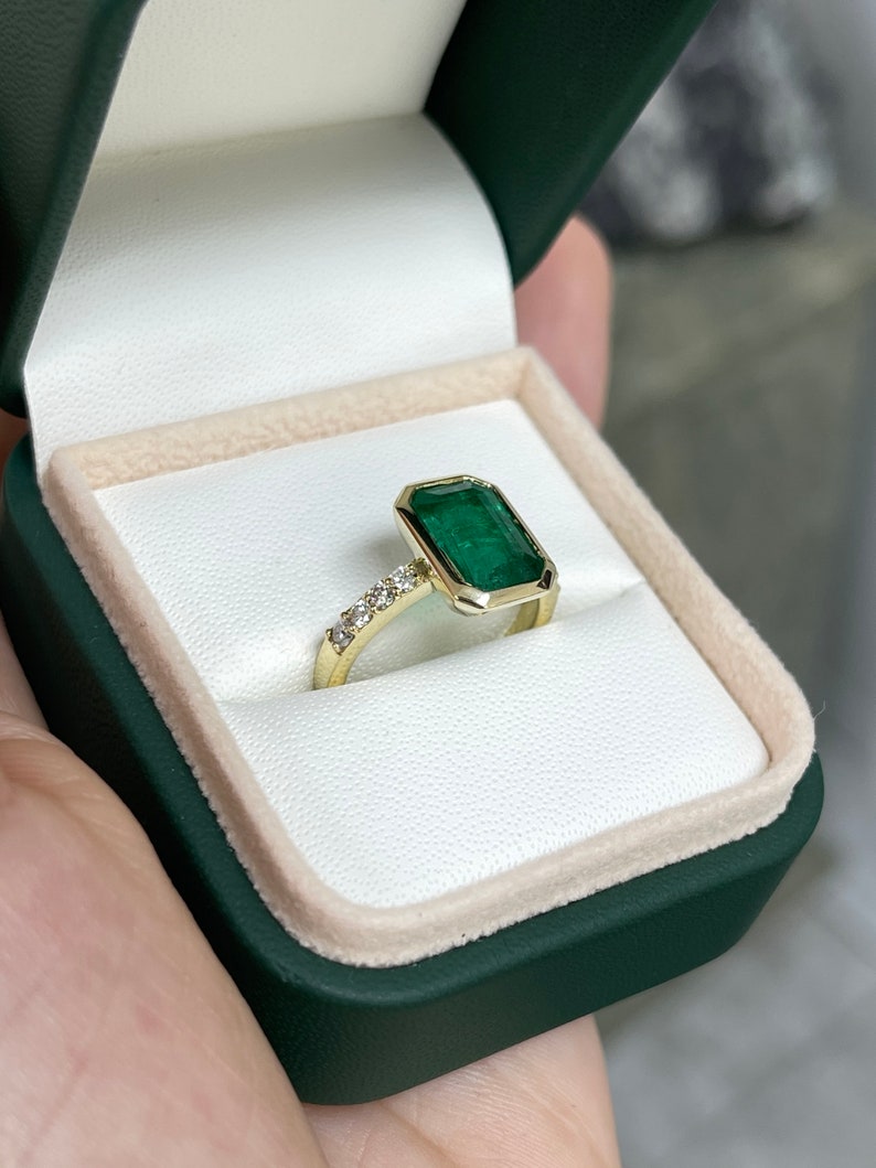 Green emerald cut engagement ring with diamond accents in 14K gold, featuring a 3.59tcw center stone from Colombian Emerald.