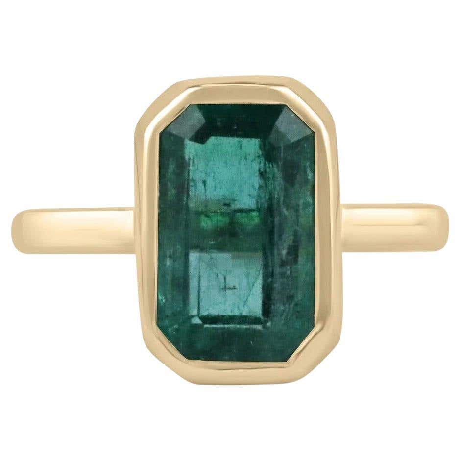 4.76ct natural emerald cut bezel solitaire engagement ring with blue-green emerald set in 14K gold by JR Colombian Emeralds