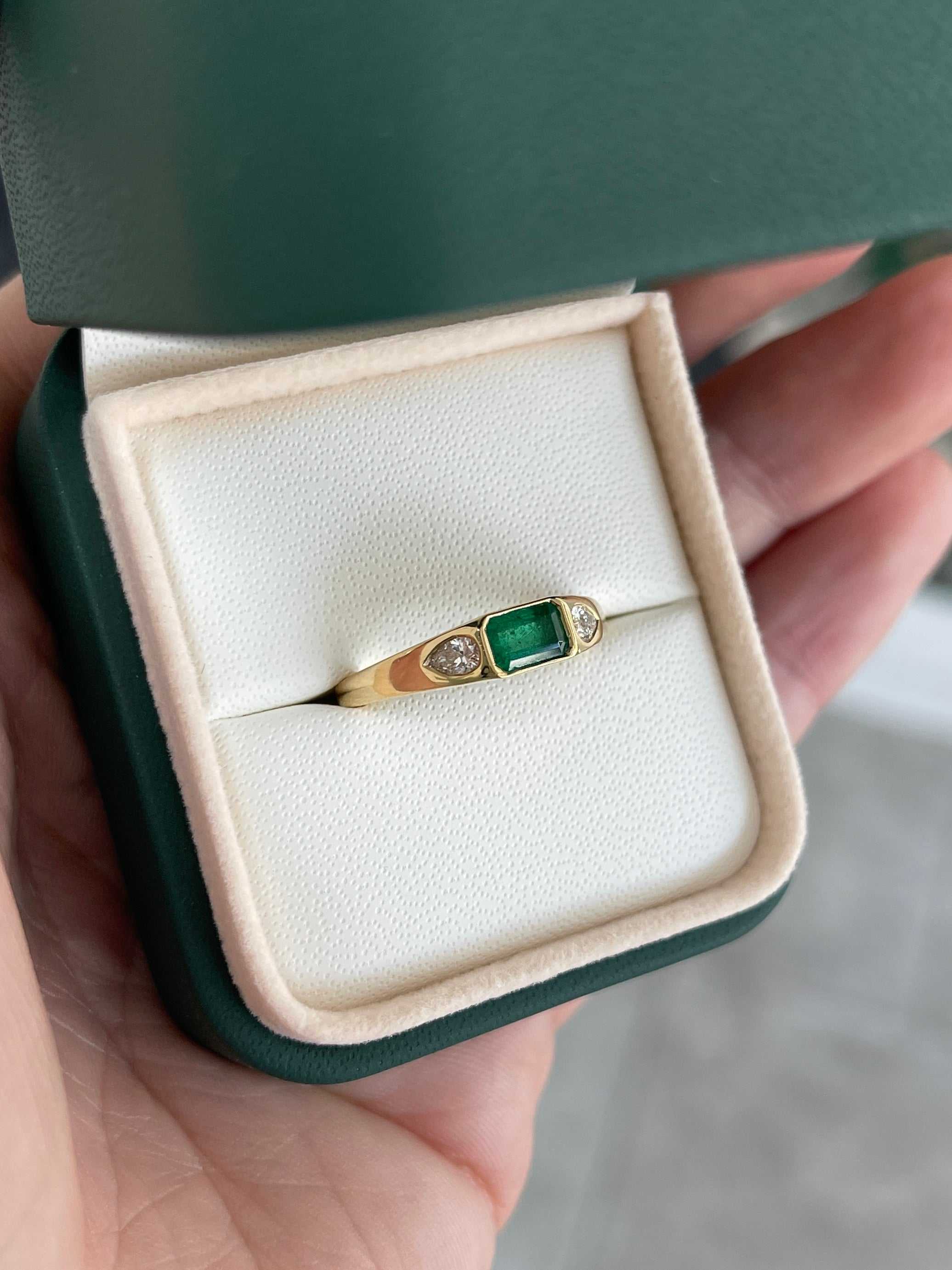 18K gold three-stone ring featuring a 0.91tcw rich green natural emerald and pear-shaped diamonds by JR Colombian Emeralds