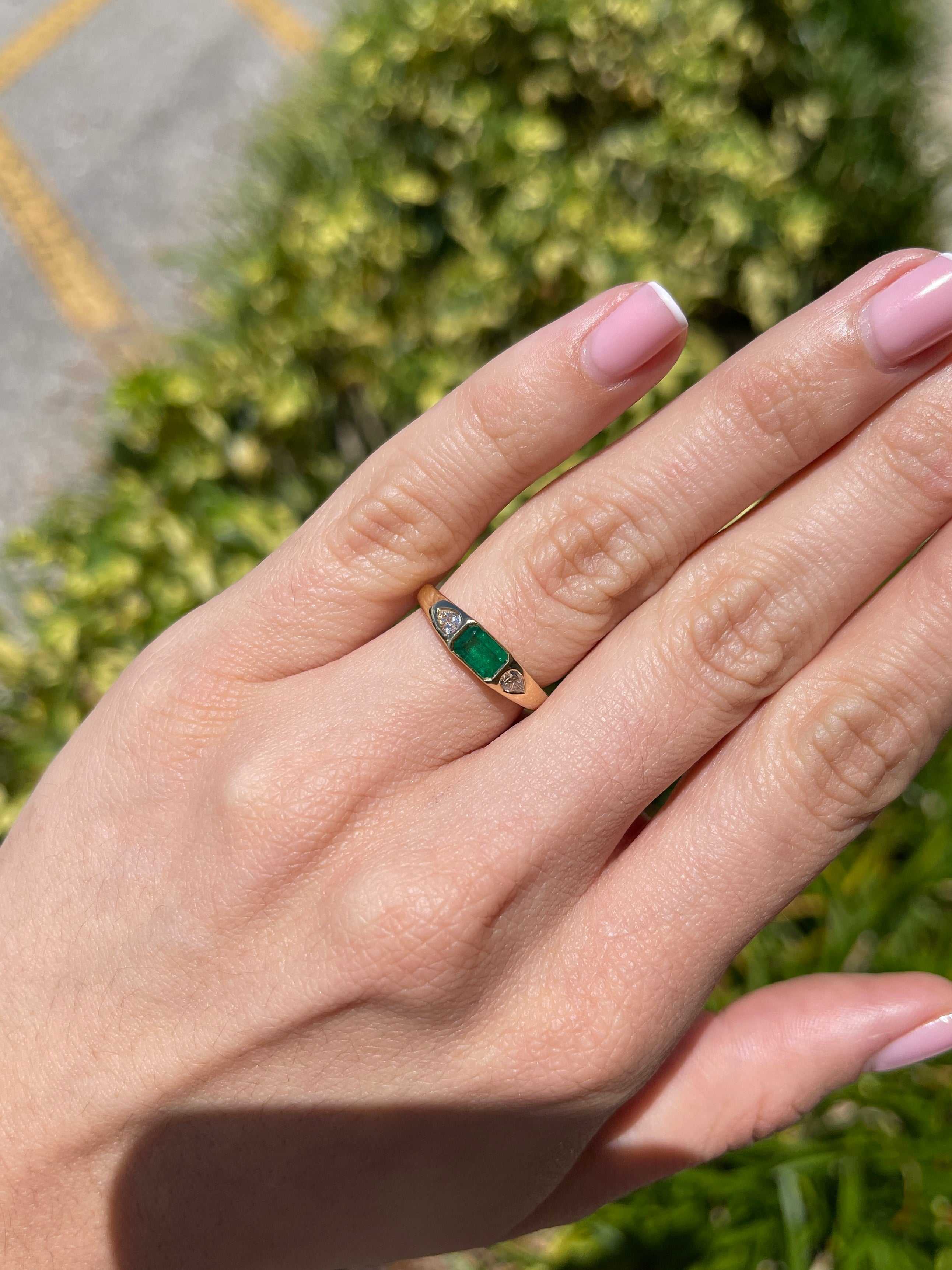 18K gold three-stone ring featuring a 0.91 carat natural emerald and pear-shaped diamonds, by JR Colombian Emeralds.