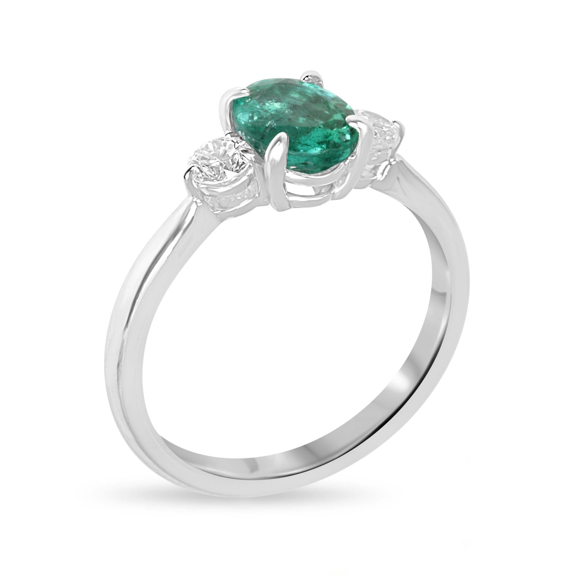 14K gold three stone ring with oval cut bluish-green emerald and round lab diamonds, featuring a 1.50tcw total weight.