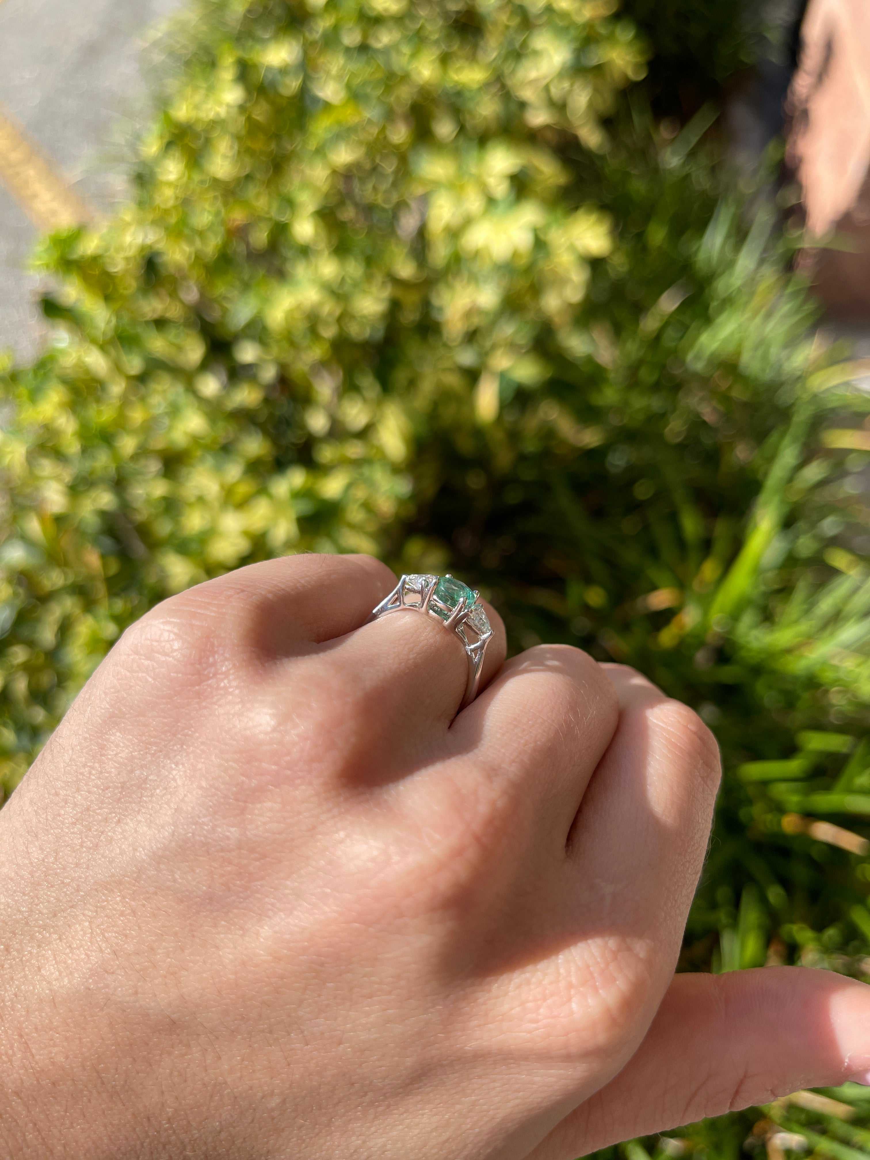 14K gold three-stone ring with 1.70tcw round cut emerald and lab diamond trillion accents, crafted by JR Colombian Emeralds.