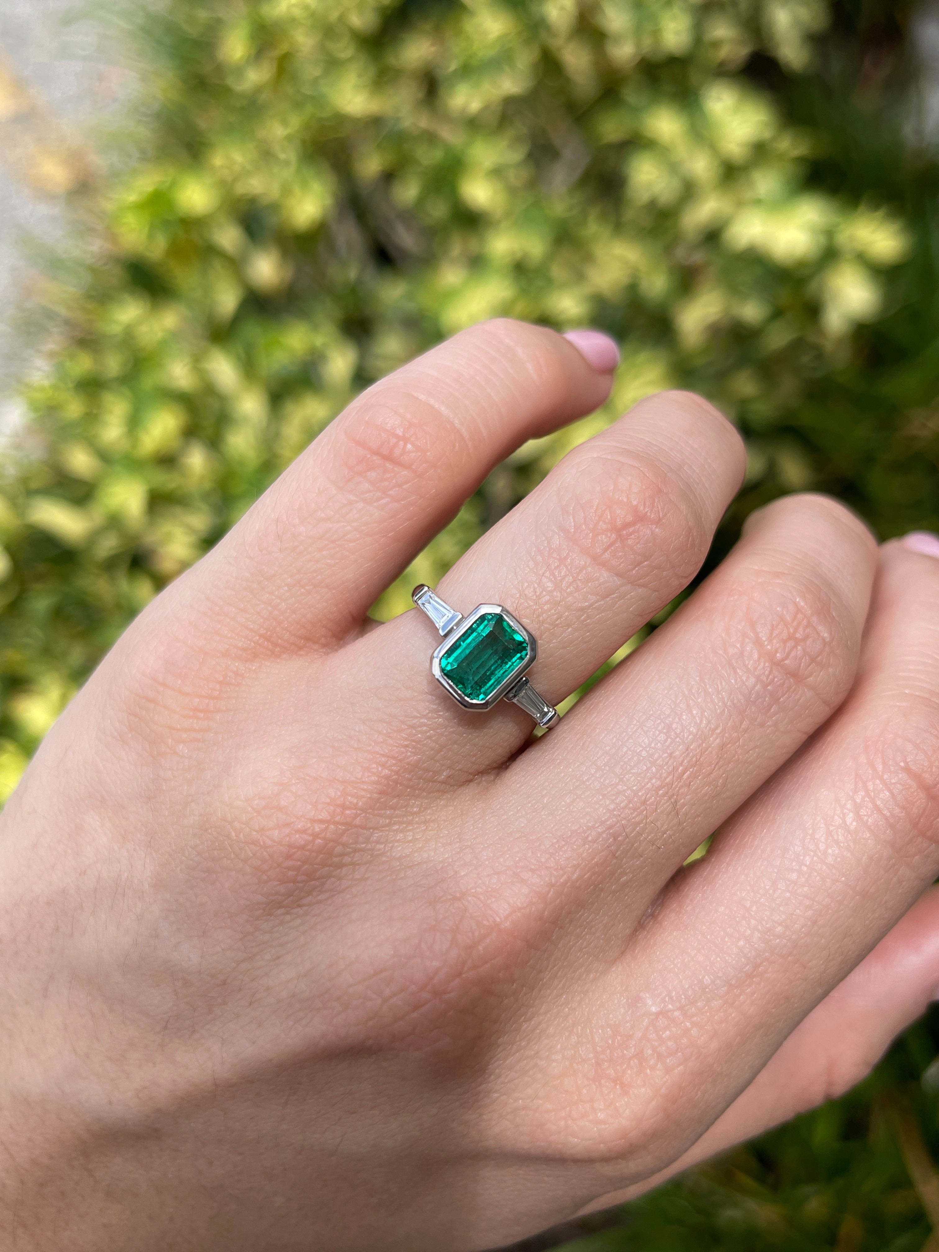 14K gold three-stone engagement ring featuring a vivid emerald-cut emerald and lab diamond baguettes by JR Colombian Emeralds.