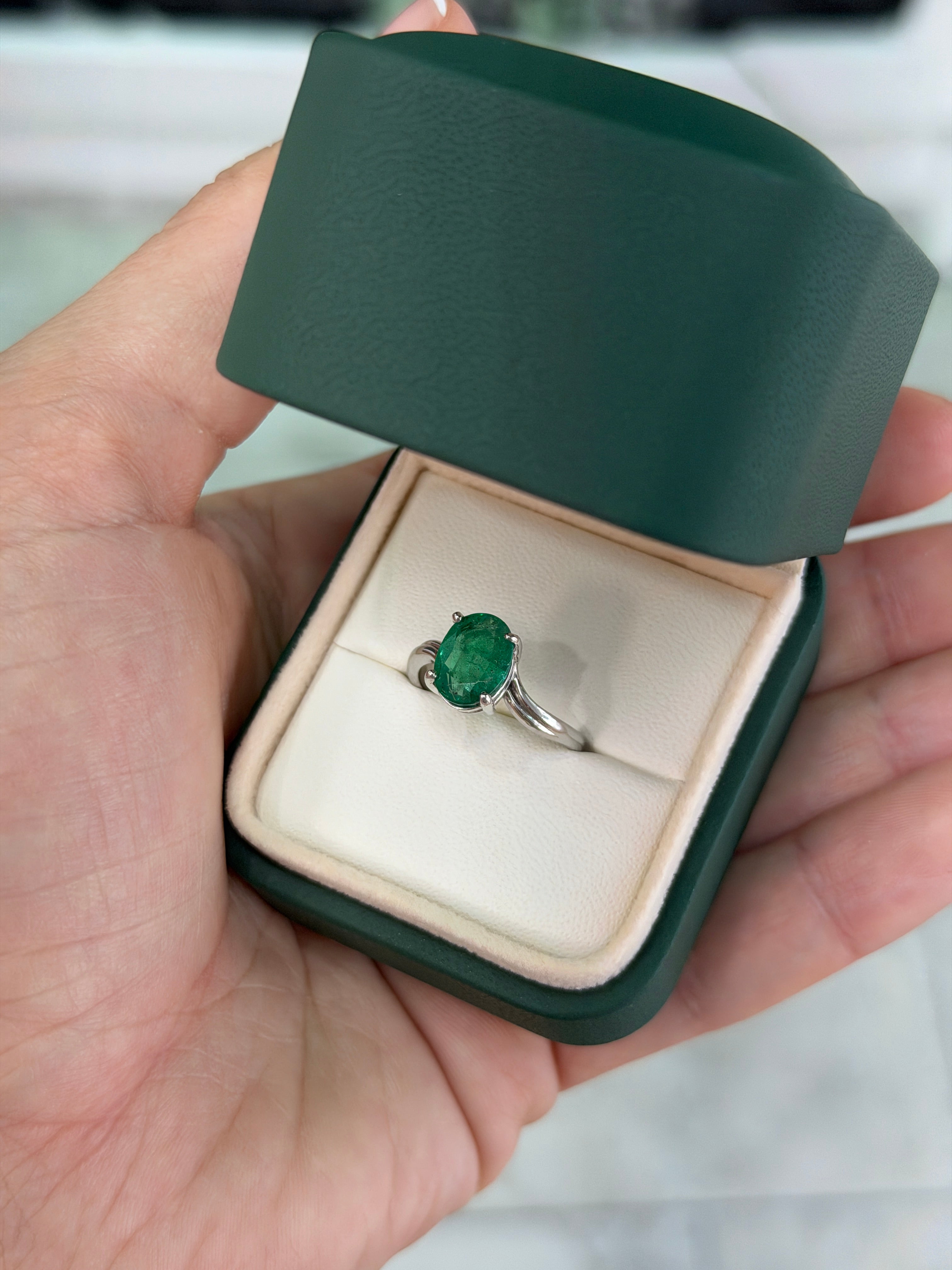 Natural 2.05ct oval emerald solitaire wave ring in 14K white gold by JR Colombian Emeralds, featuring a lush green emerald centerpiece.