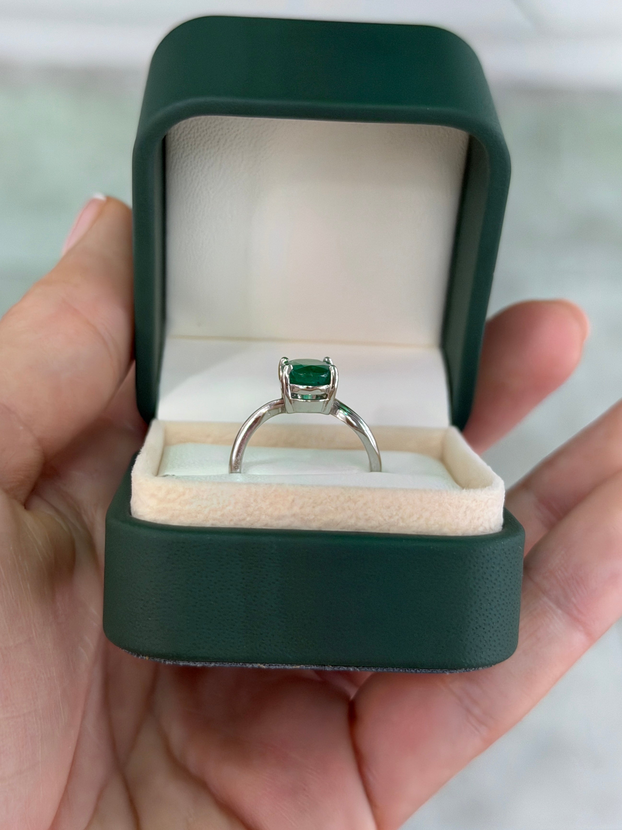 Natural 2.05ct oval emerald solitaire wave ring in 14K white gold by JR Colombian Emeralds, featuring a vibrant green emerald centerpiece.