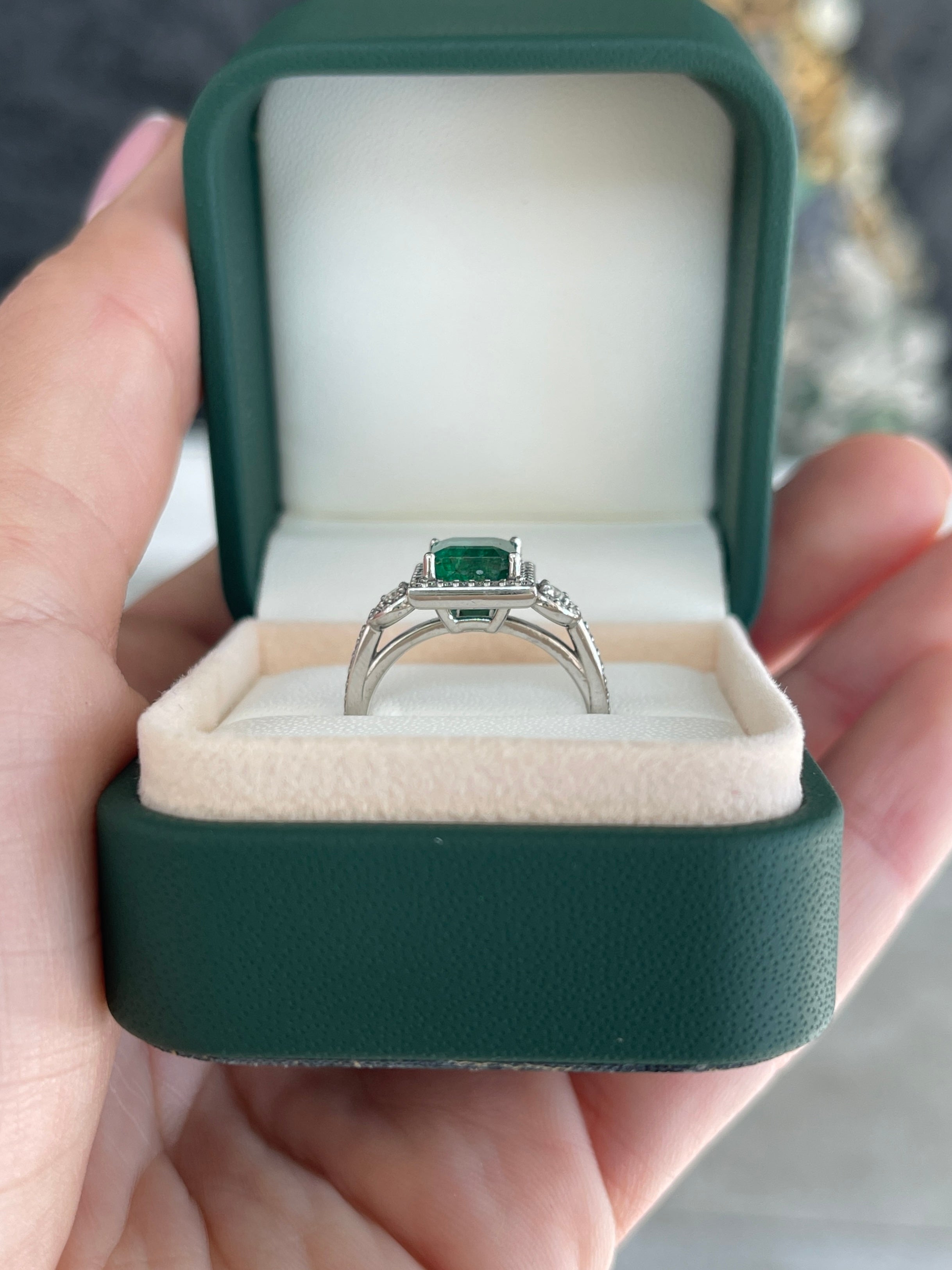 14K gold engagement ring featuring a 2.20tcw Asscher cut emerald and diamond halo accents by JR Colombian Emeralds.