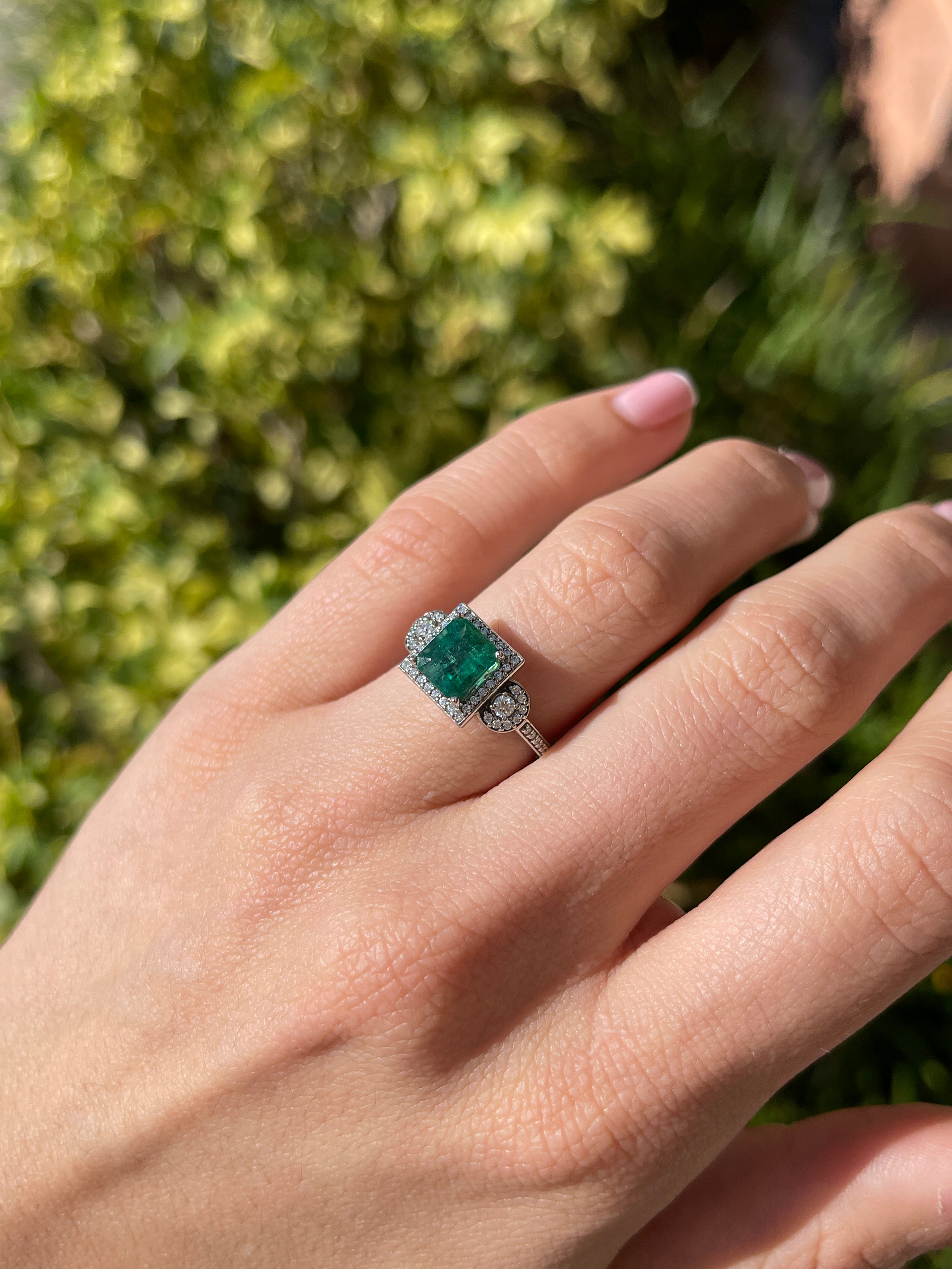 14K gold engagement ring with a 2.20tcw green Asscher emerald and diamond halo accent, by JR Colombian Emeralds.
