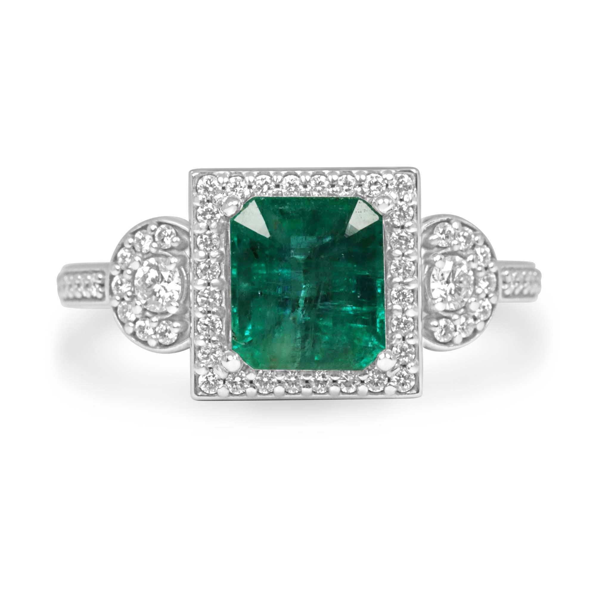 14K gold engagement ring with 2.20tcw rich green Asscher emerald and diamond halo accents, showcasing detailed craftsmanship.