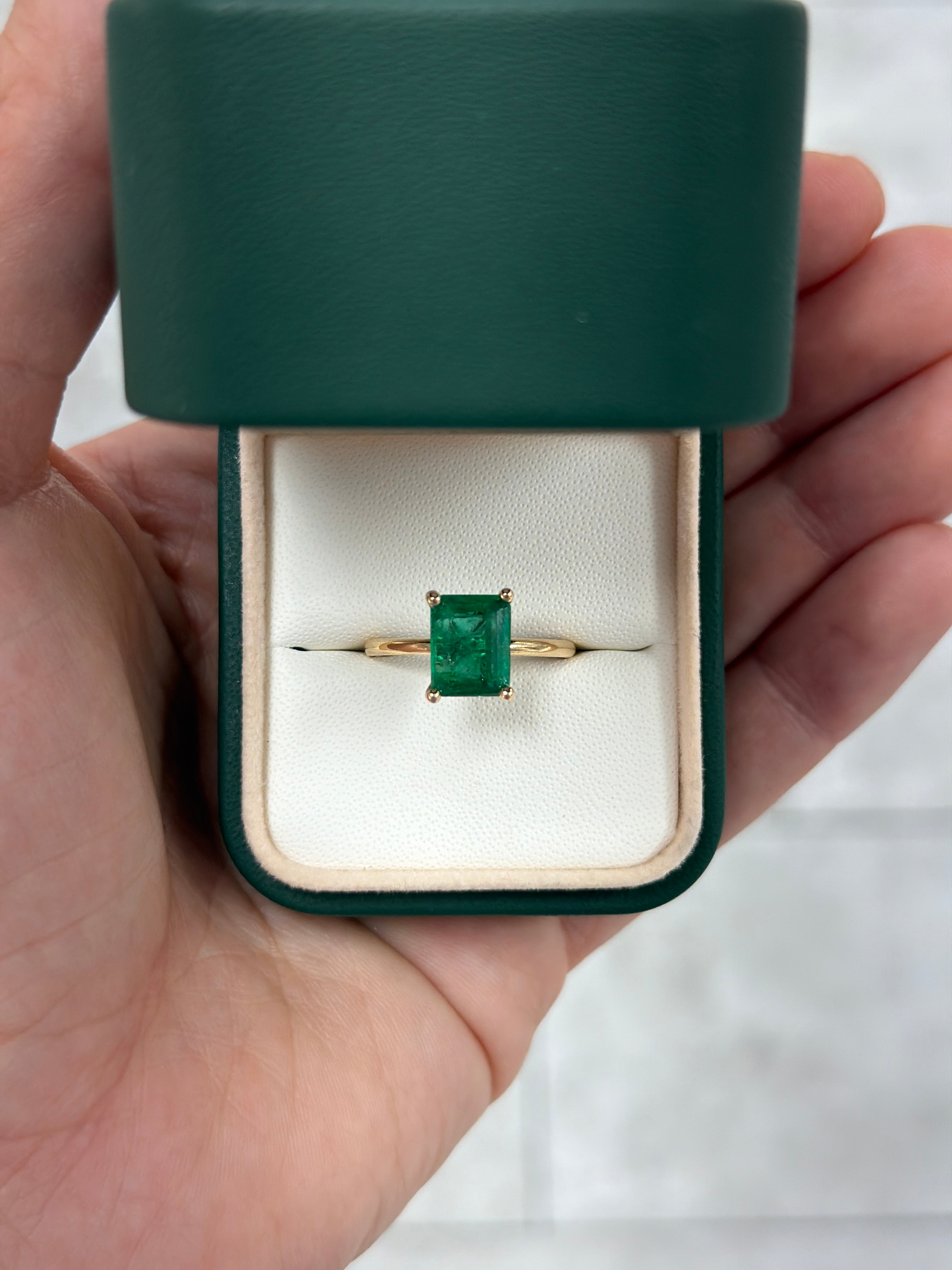 Natural emerald solitaire ring featuring a 2.32 carat emerald in a 14K four-prong setting by JR Colombian Emeralds
