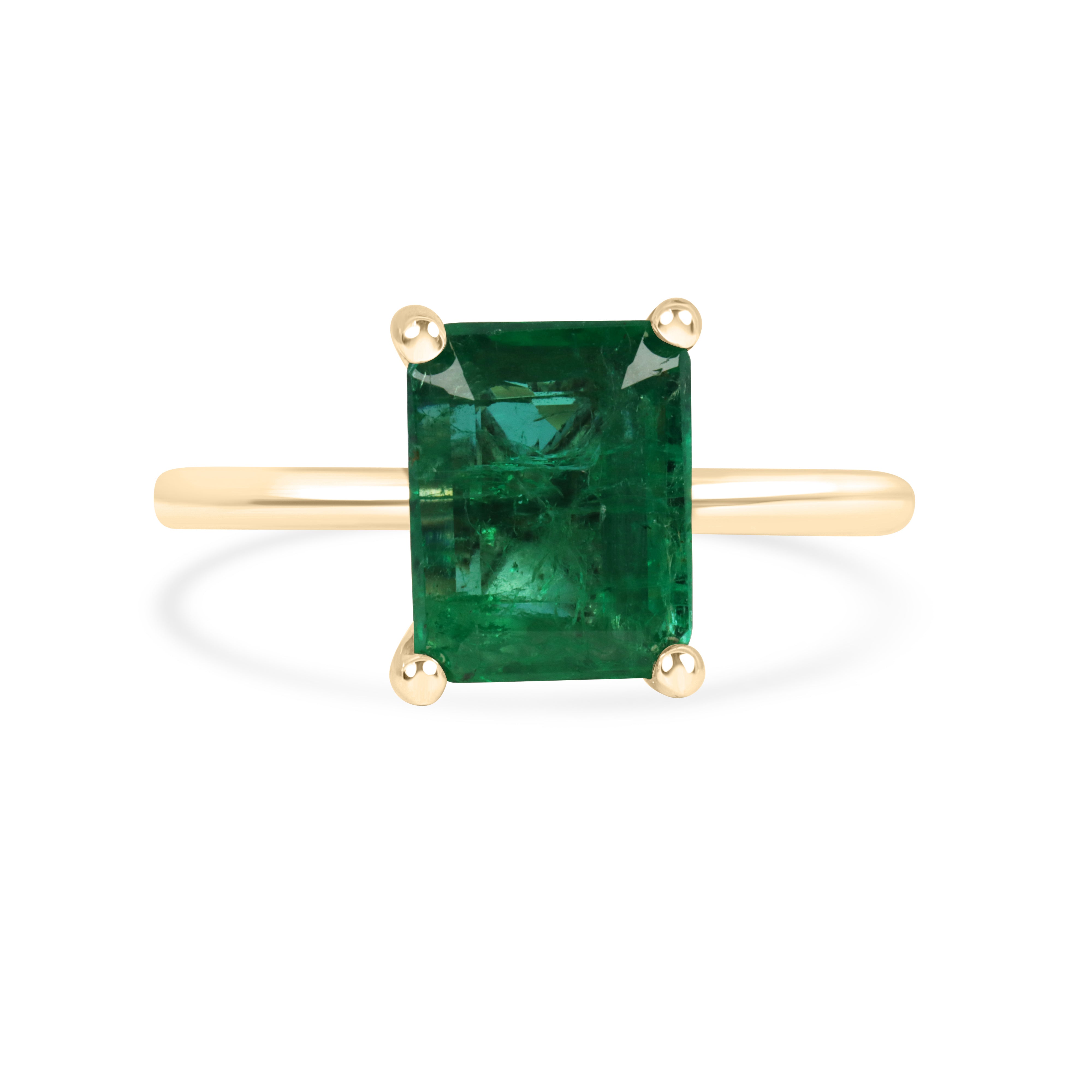 Natural emerald solitaire ring featuring a 2.32 carat emerald with four prongs set in 14K gold, by JR Colombian Emeralds.