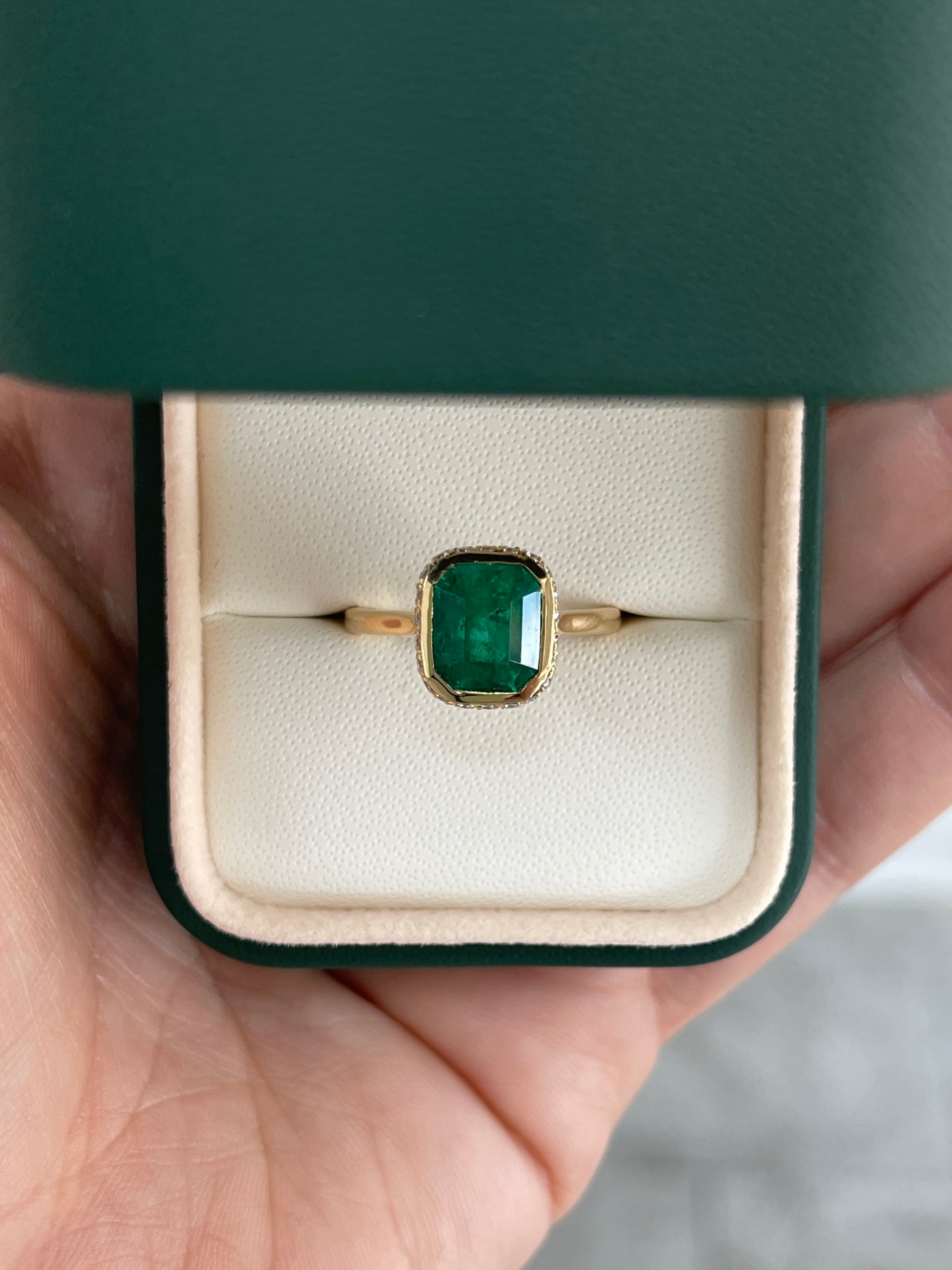 14K Colombian Emerald and diamond pave halo statement ring featuring a 3.19tcw emerald bezel by JR Colombian Emeralds.