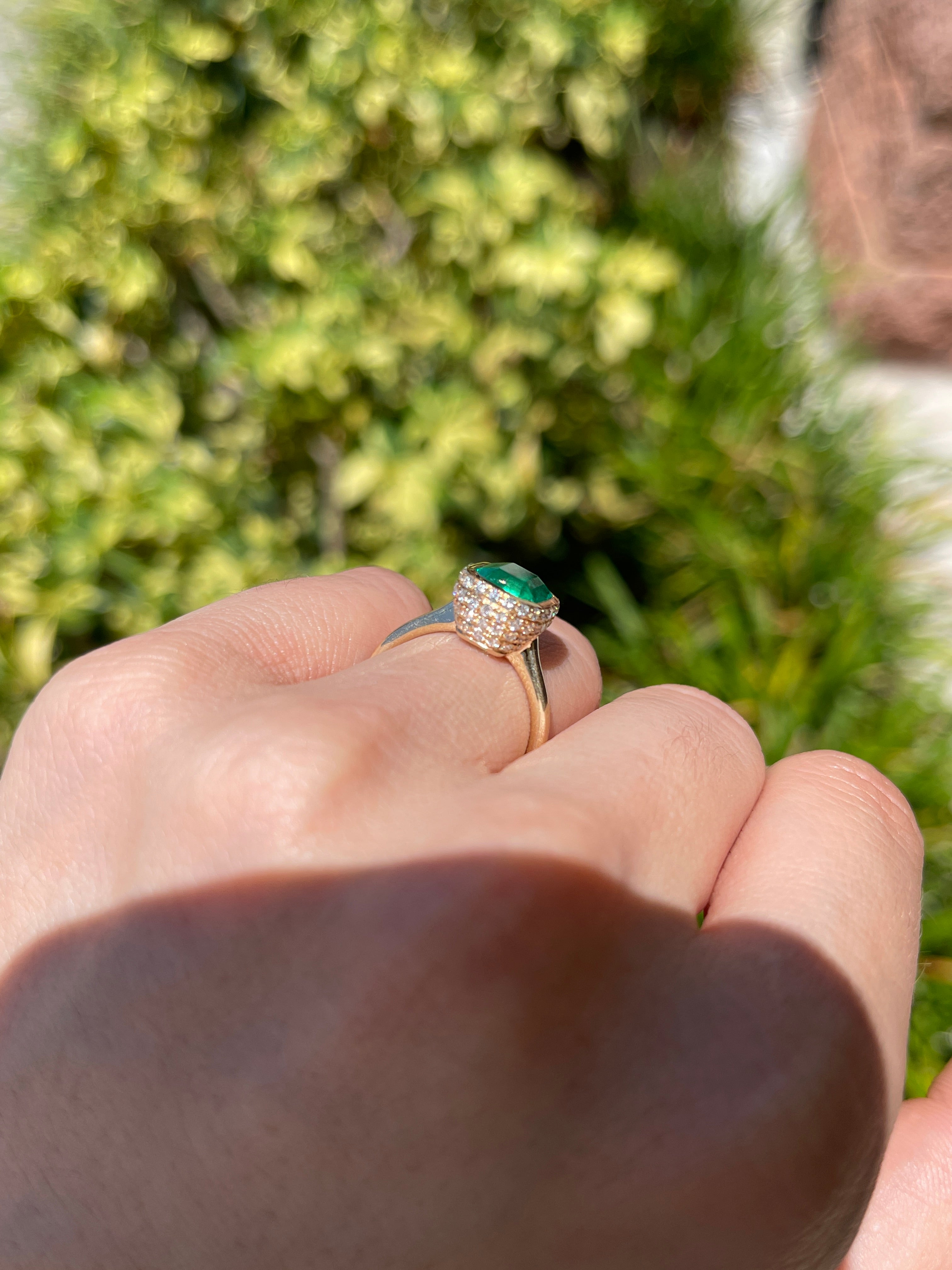 14K Colombian emerald and diamond pave halo statement ring featuring a bezel-set emerald and hidden halo design by JR Colombian Emeralds