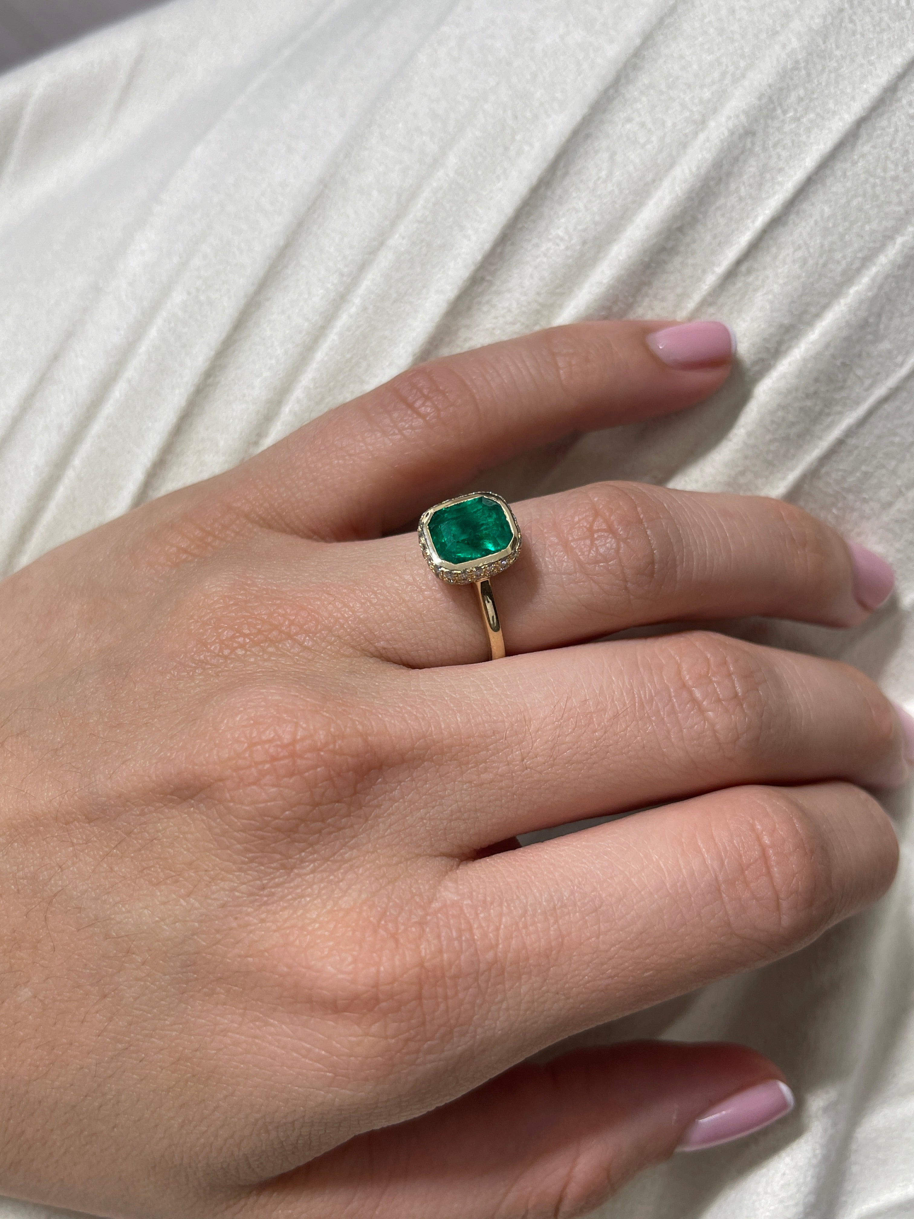 14K Colombian Emerald and diamond pave halo statement ring featuring a 3.19tcw emerald bezel by JR Colombian Emeralds.
