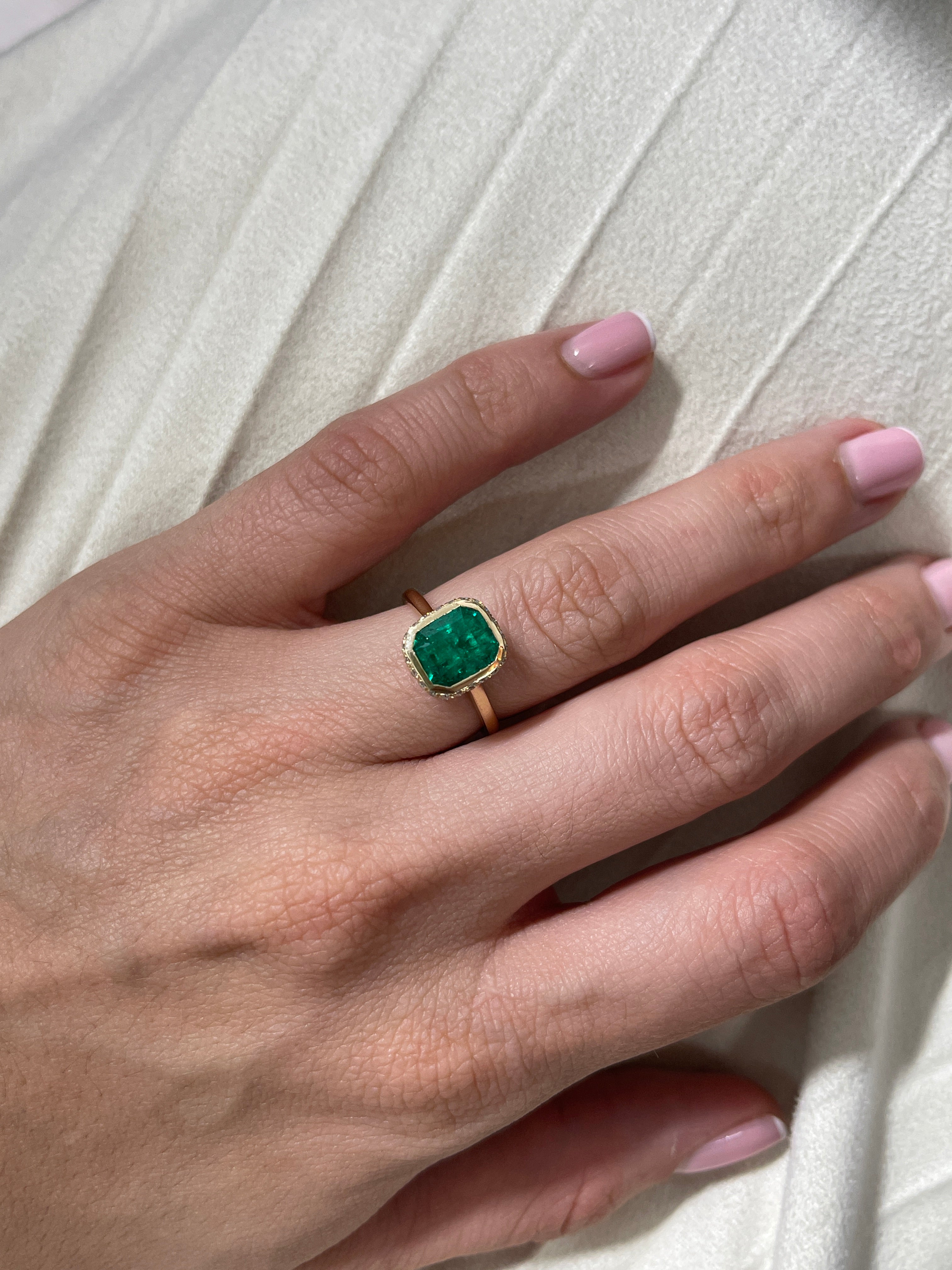 14K Colombian Emerald and diamond pave halo statement ring featuring bezel setting and hidden halo design by JR Colombian Emeralds