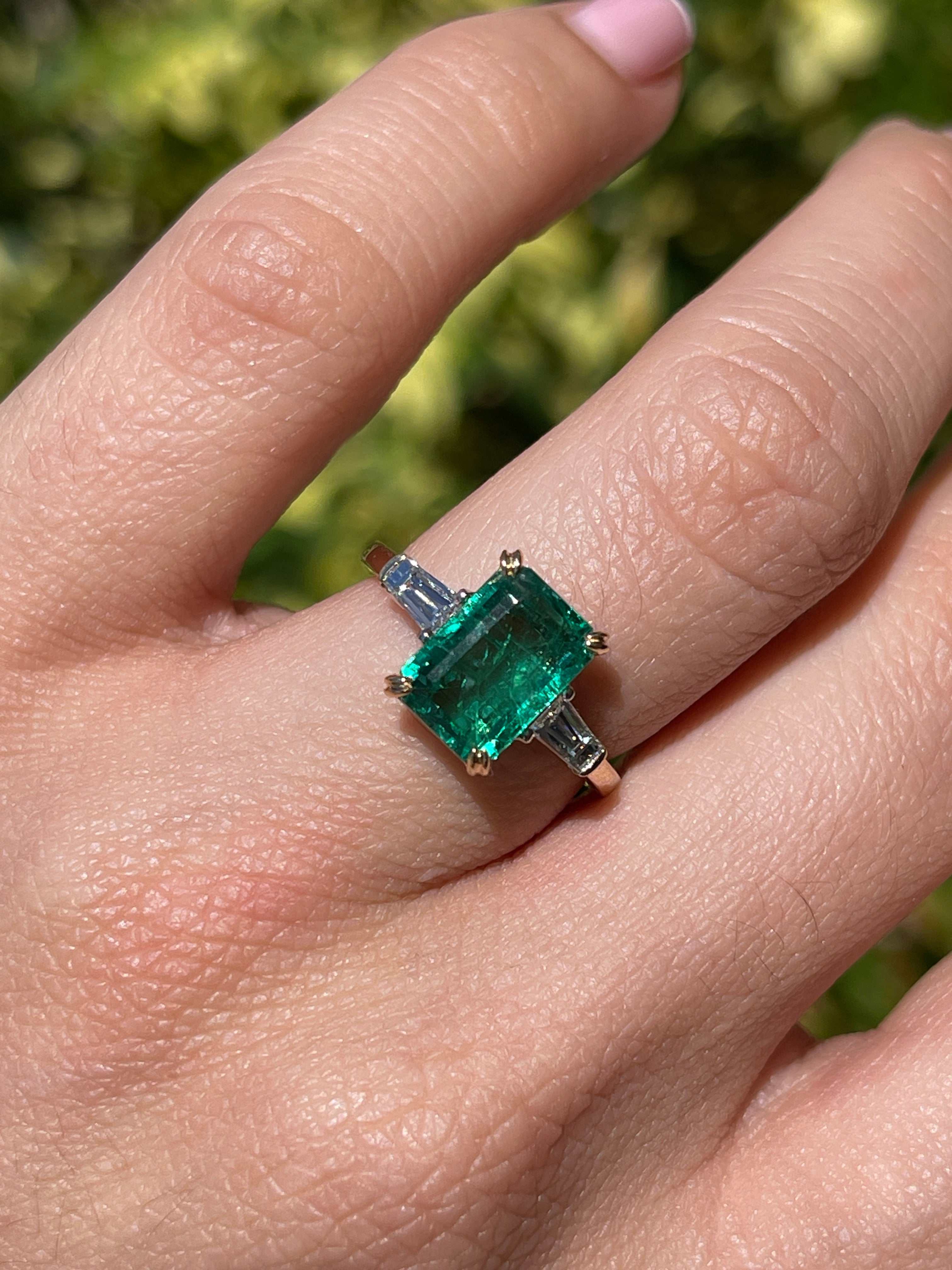 JR Colombian Emeralds 14K two-tone natural emerald cut emerald and baguette diamond three-stone engagement ring image.