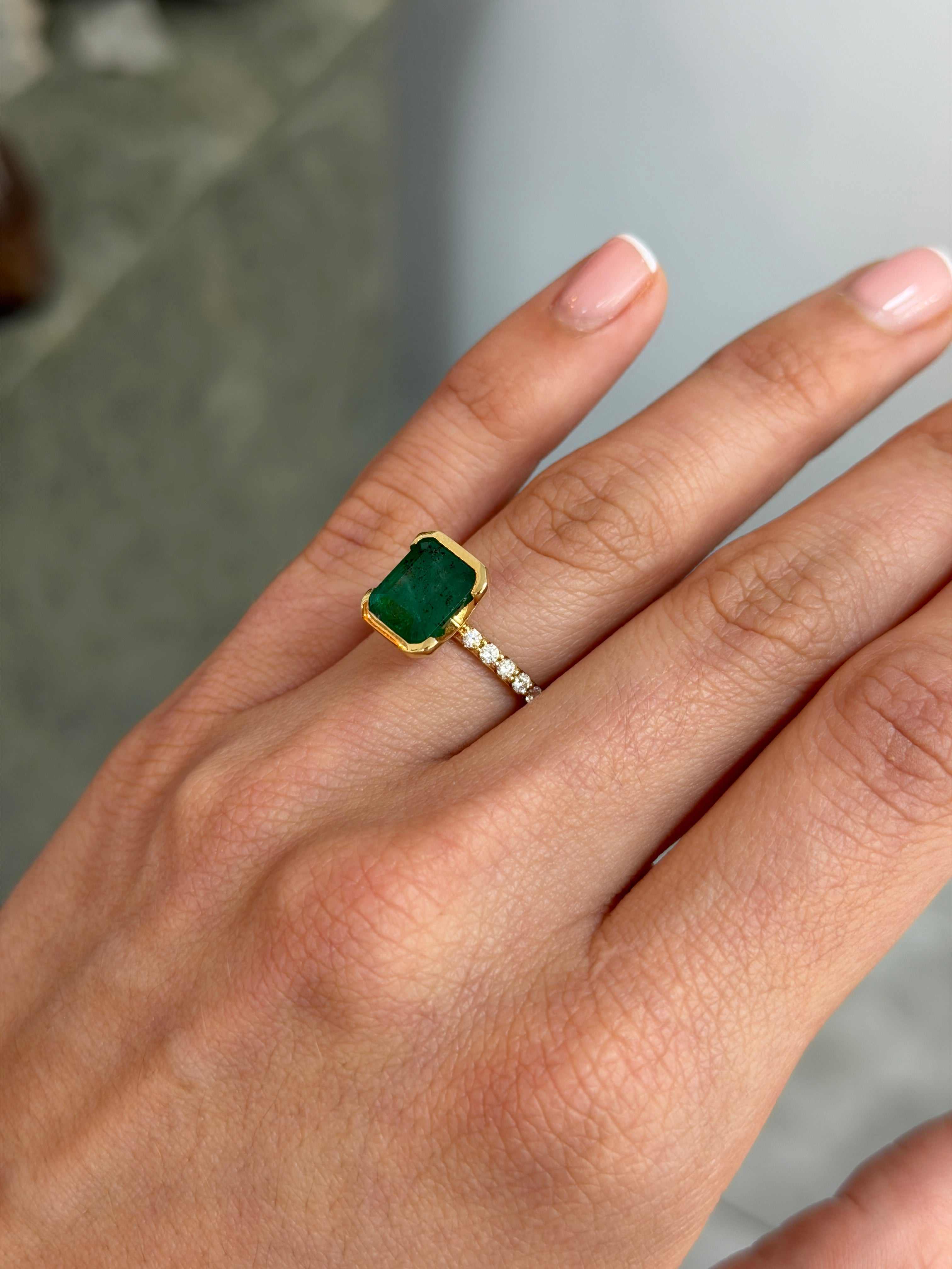 Natural emerald and diamond stacking ring in 14K gold featuring semi-bezel setting and 3.69tcw emerald from JR Colombian Emeralds.