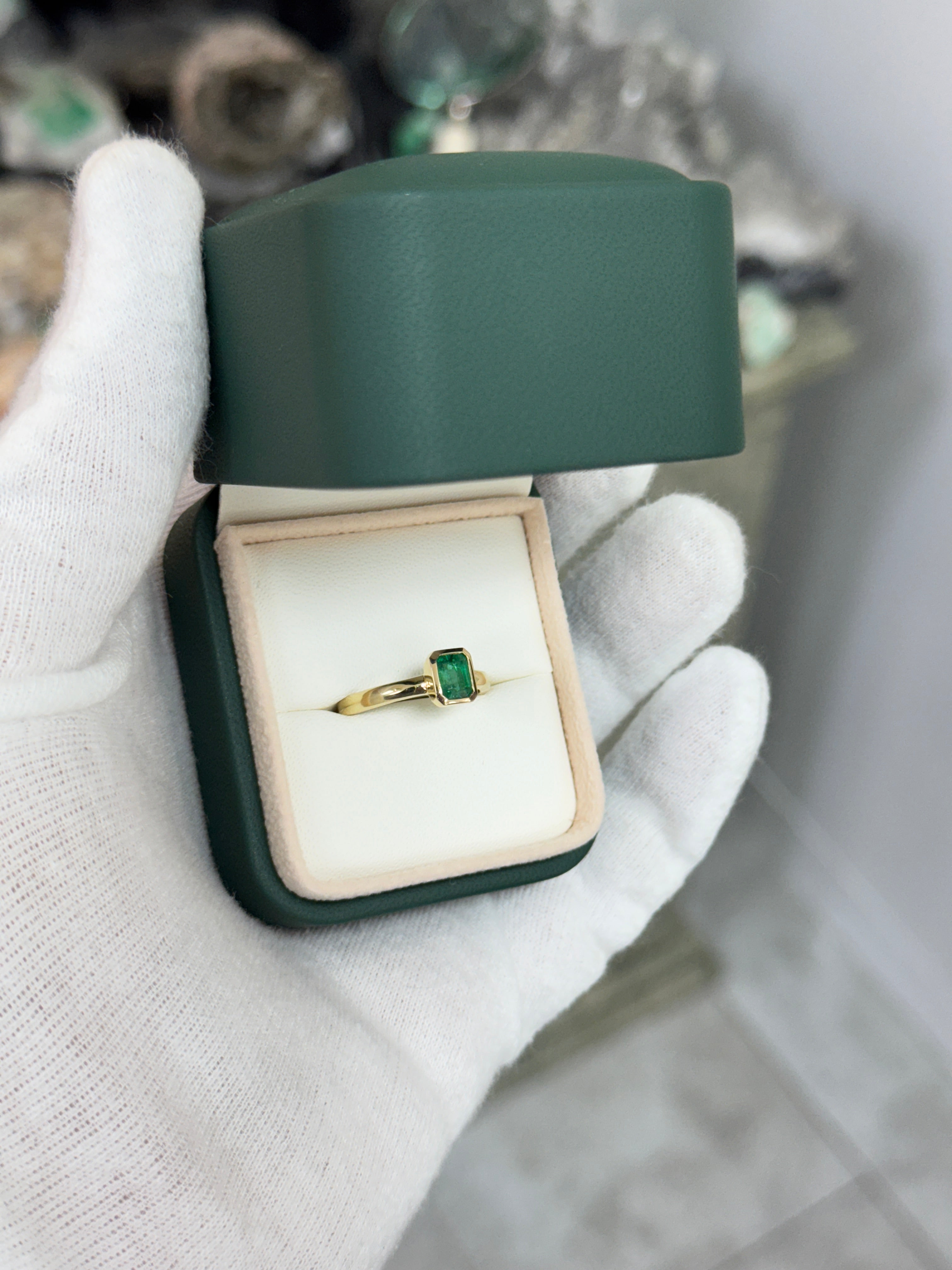 14K gold ladies ring with a 0.90ct bezel set natural emerald, elegant jewelry piece by JR Colombian Emeralds.