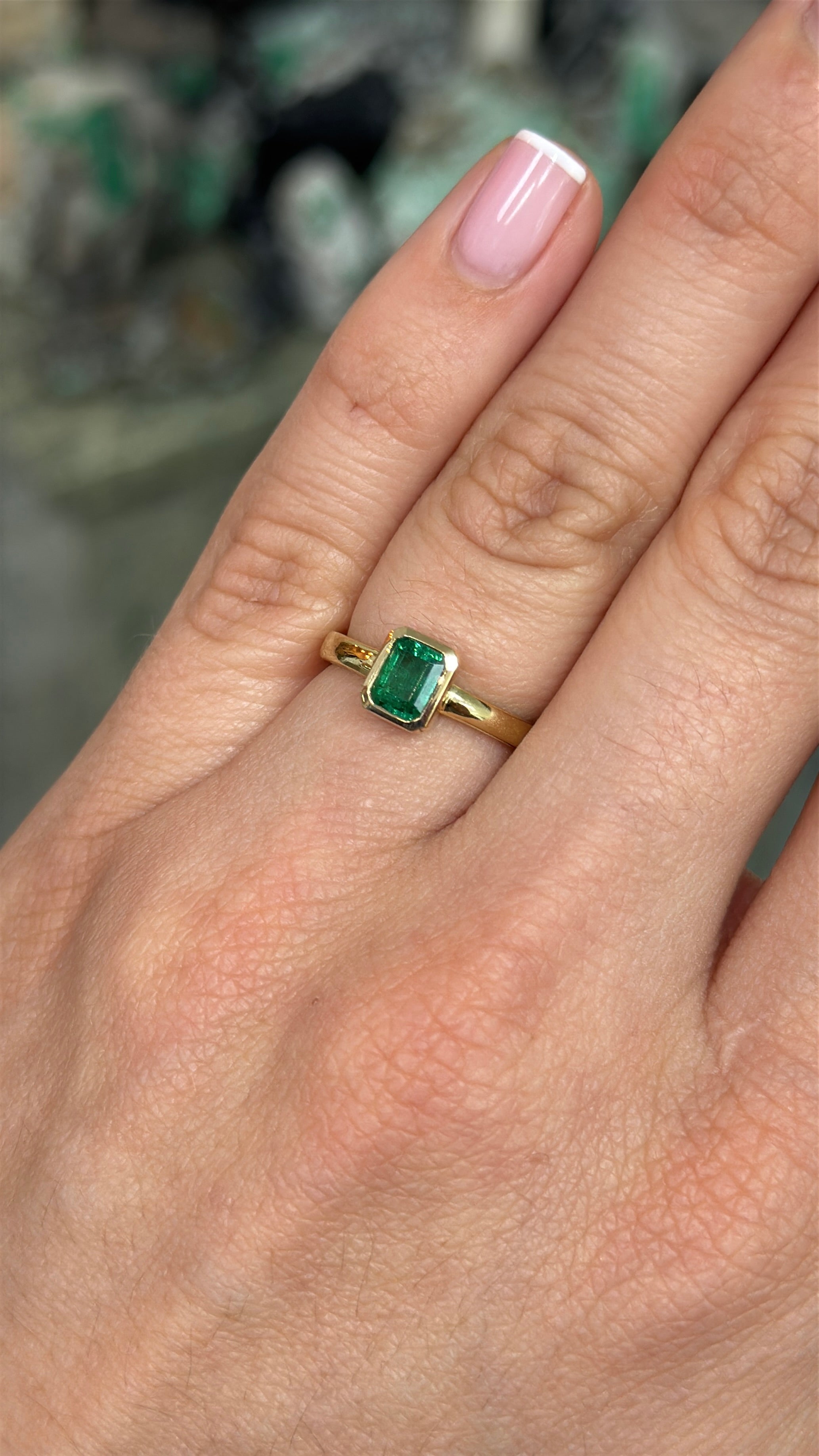 14K gold ladies ring featuring a 0.90ct bezel set natural emerald by JR Colombian Emeralds