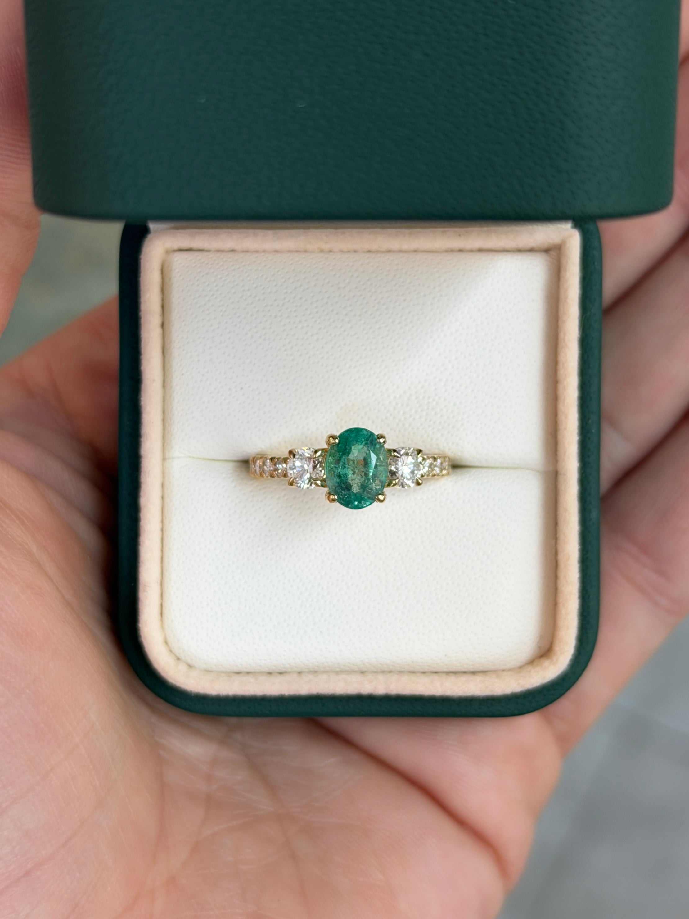14K lab diamond three-stone ring with oval emerald and round diamonds, accented, by JR Colombian Emeralds.