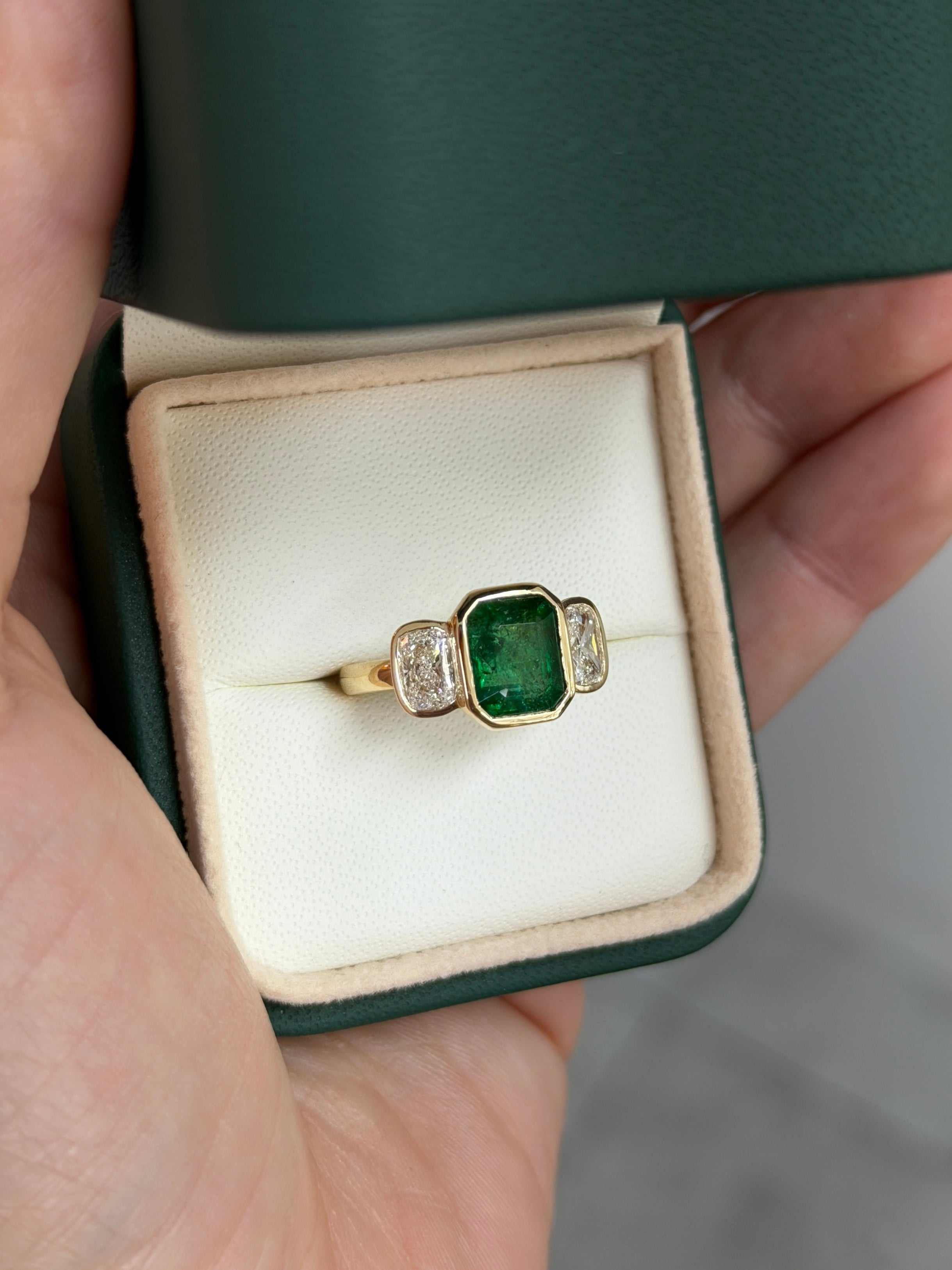 Bezel set emerald and cushion cut lab diamond three stone ring in 14K gold by JR Colombian Emeralds.