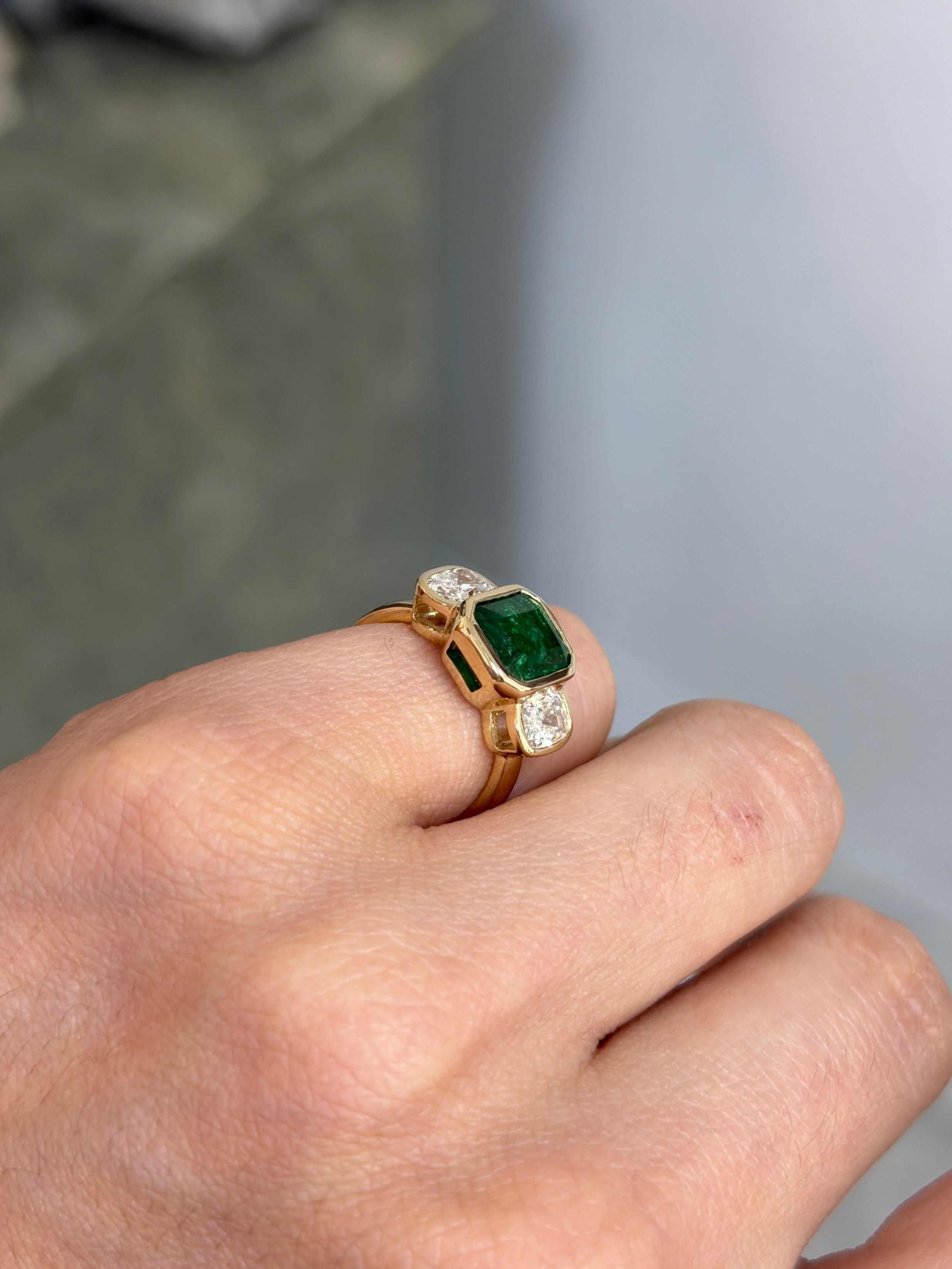 3.70tcw lab diamond three-stone ring with bezel set emerald and cushion cut stones in 14K gold, by JR Colombian Emeralds