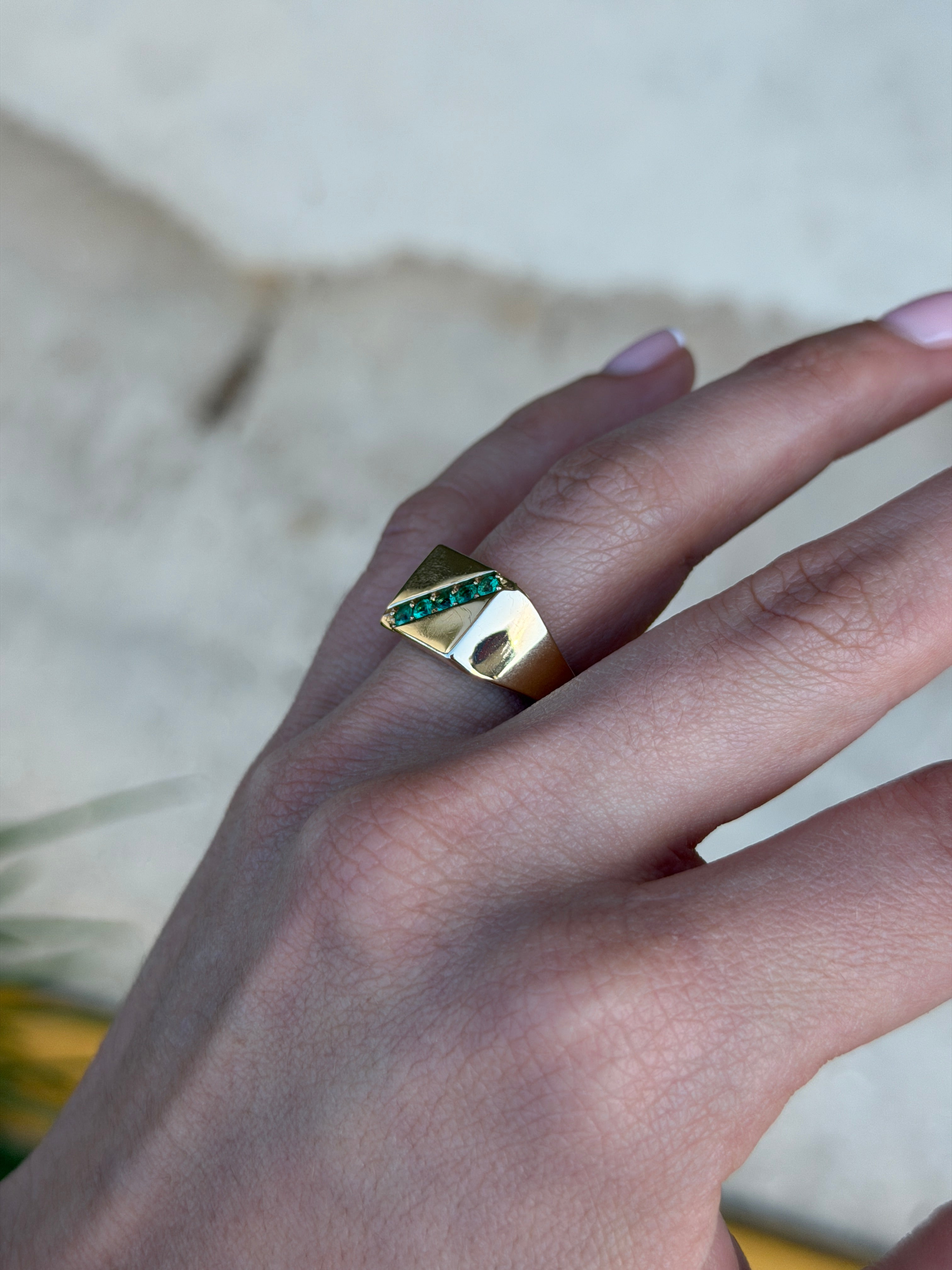 14K gold men's signet ring with round emeralds and channel setting, featuring 0.35 total carat weight from JR Colombian Emeralds.