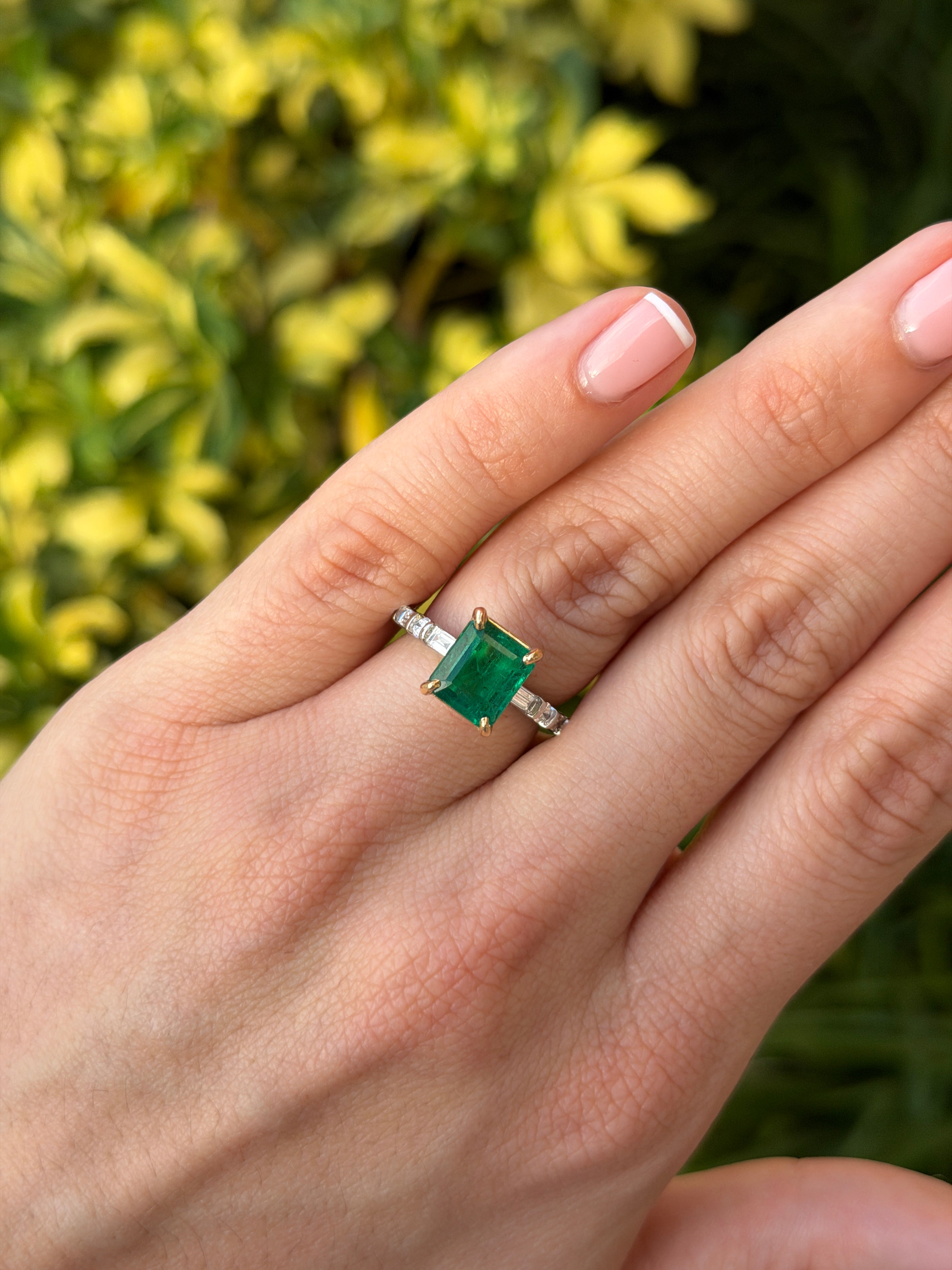 18K gold engagement ring with vivid natural emerald and platinum diamond baguette accents, by JR Colombian Emeralds.