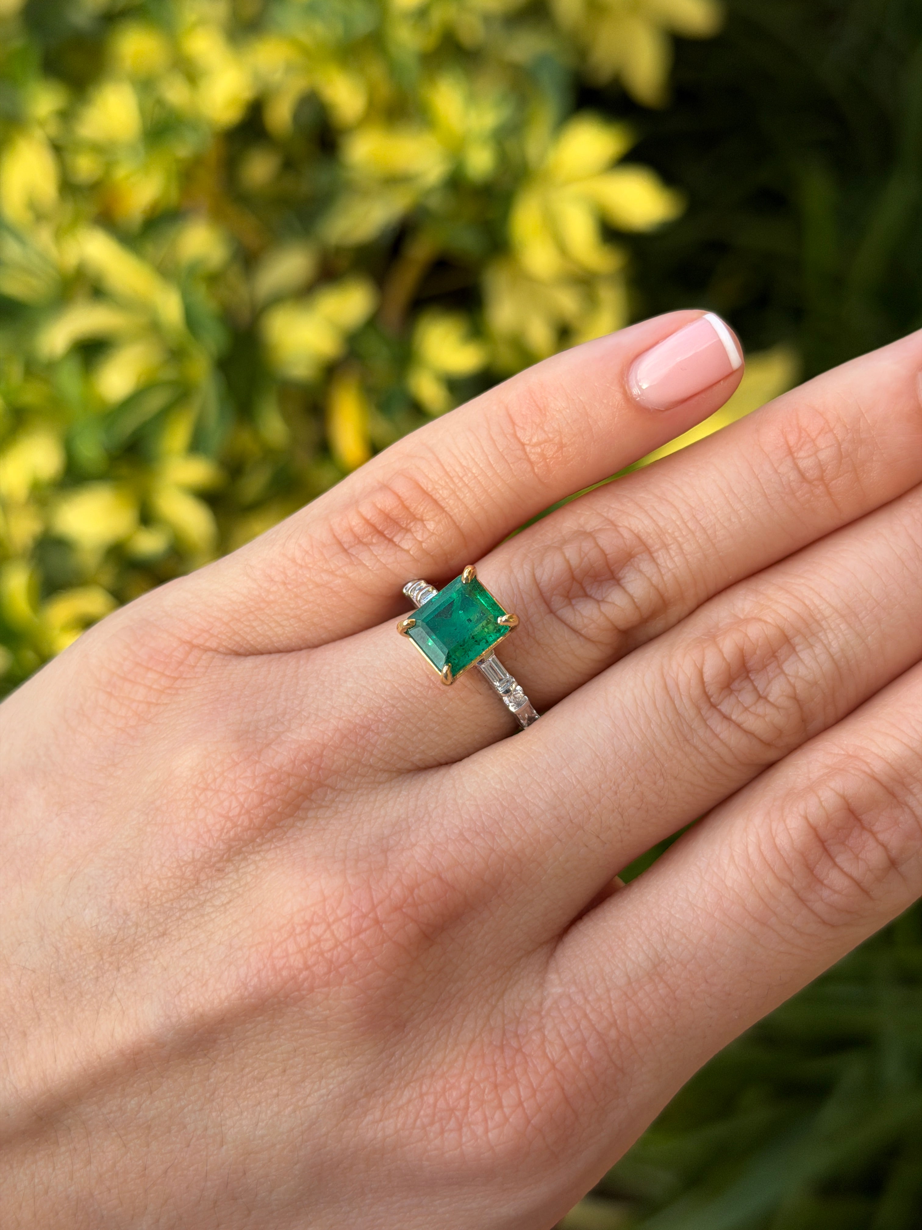 Elegant engagement ring featuring a 3.55-carat vivid natural emerald with platinum diamond baguette shank by JR Colombian Emeralds.
