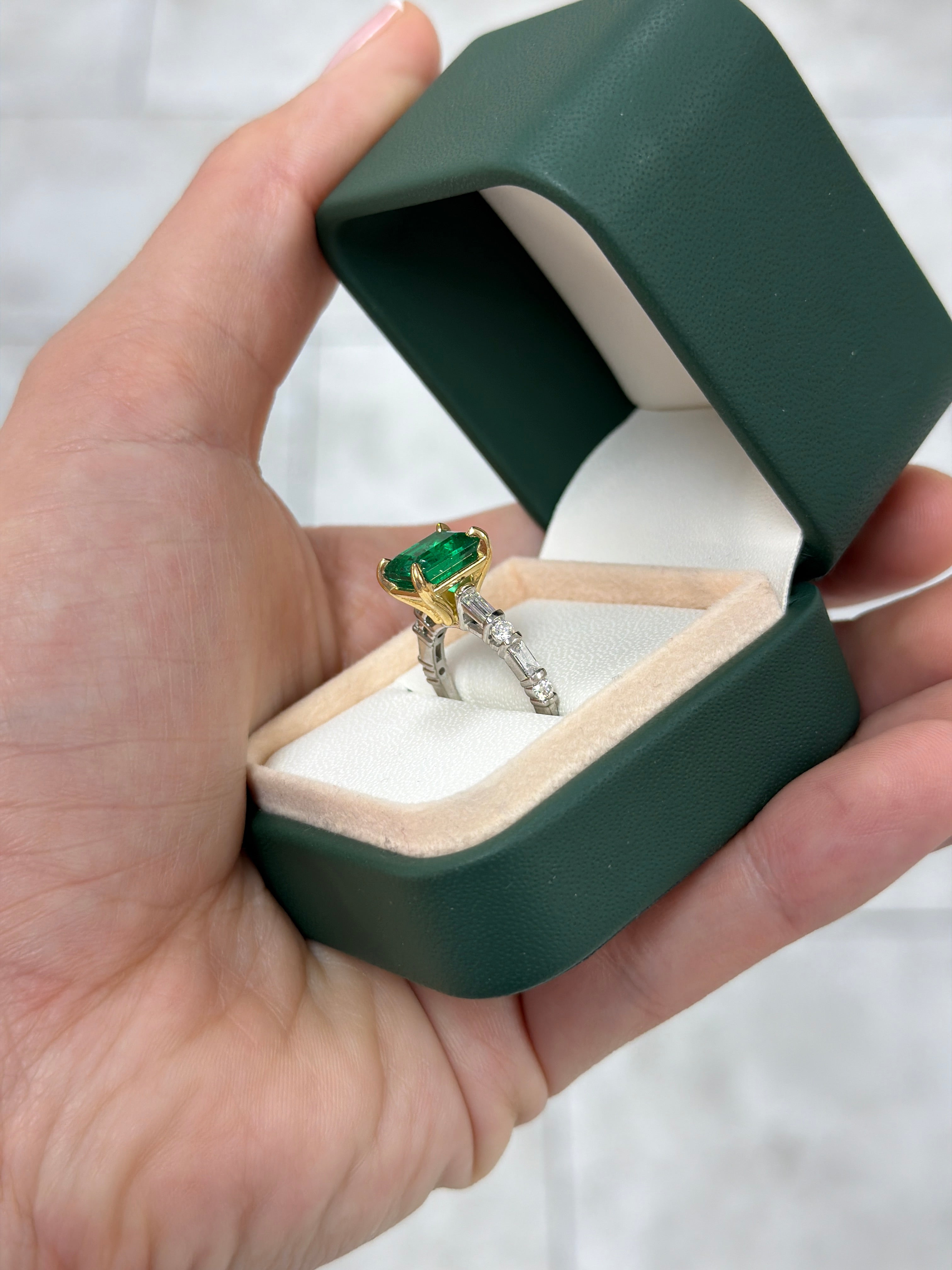 18K gold engagement ring with 3.55tcw vivid natural emerald and platinum diamond baguette accents, by JR Colombian Emeralds.