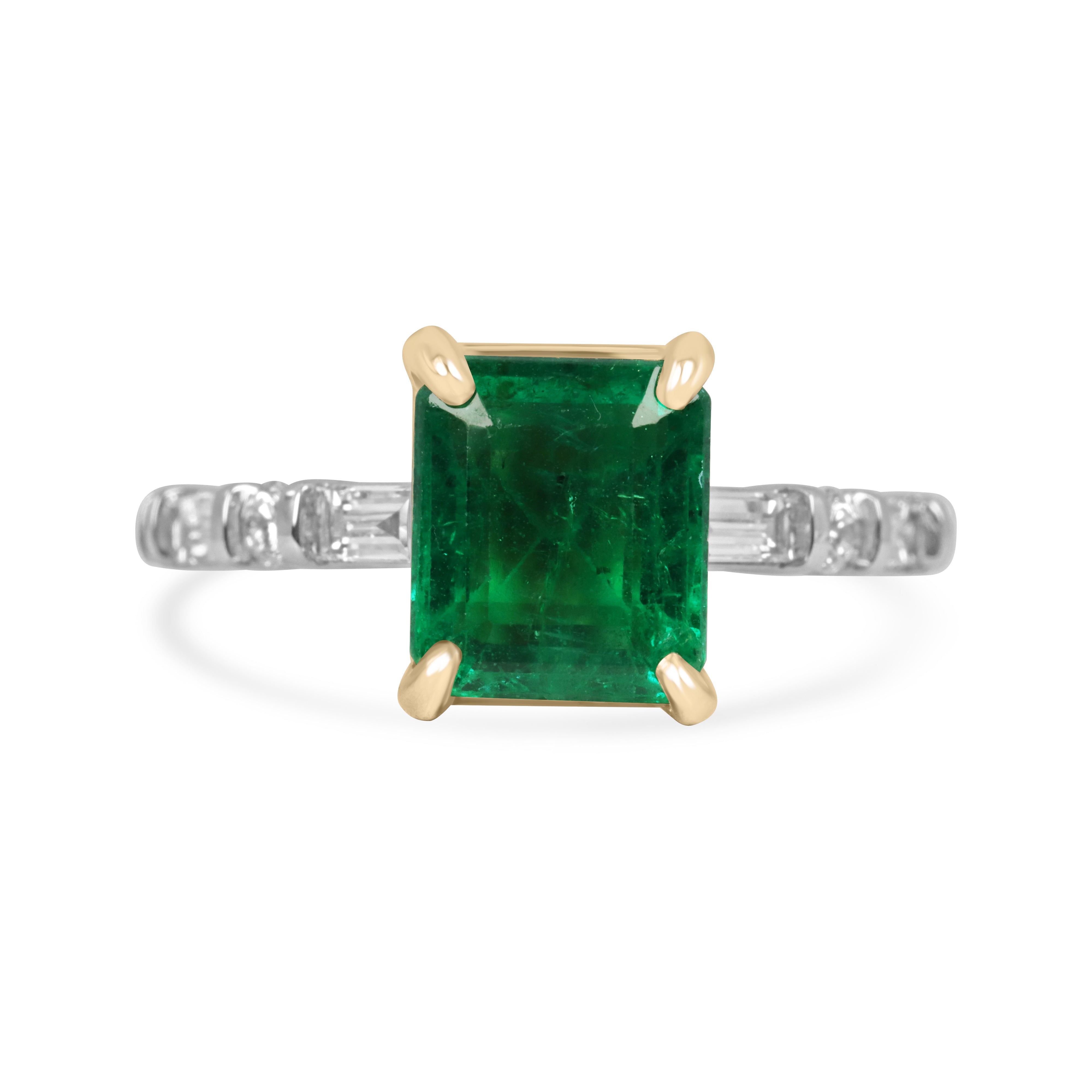 18K gold engagement ring with vivid natural emerald and platinum diamond baguette accents, featuring a 3.55 carat total weight.
