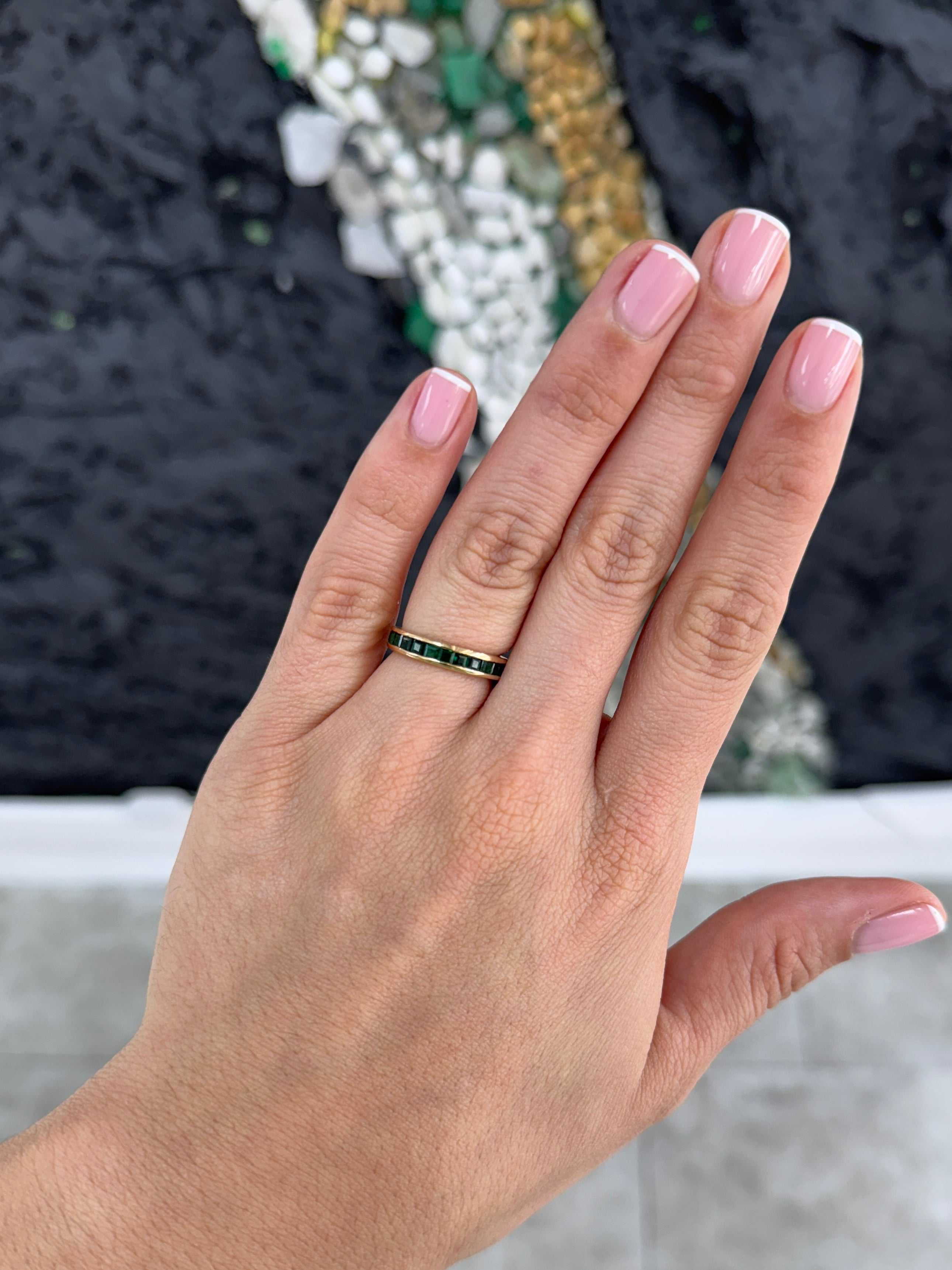JR Colombian Emeralds 2.02tcw princess cut natural emerald eternity band, channel set, size 6 and 8, showcasing elegant gemstone craftsmanship.