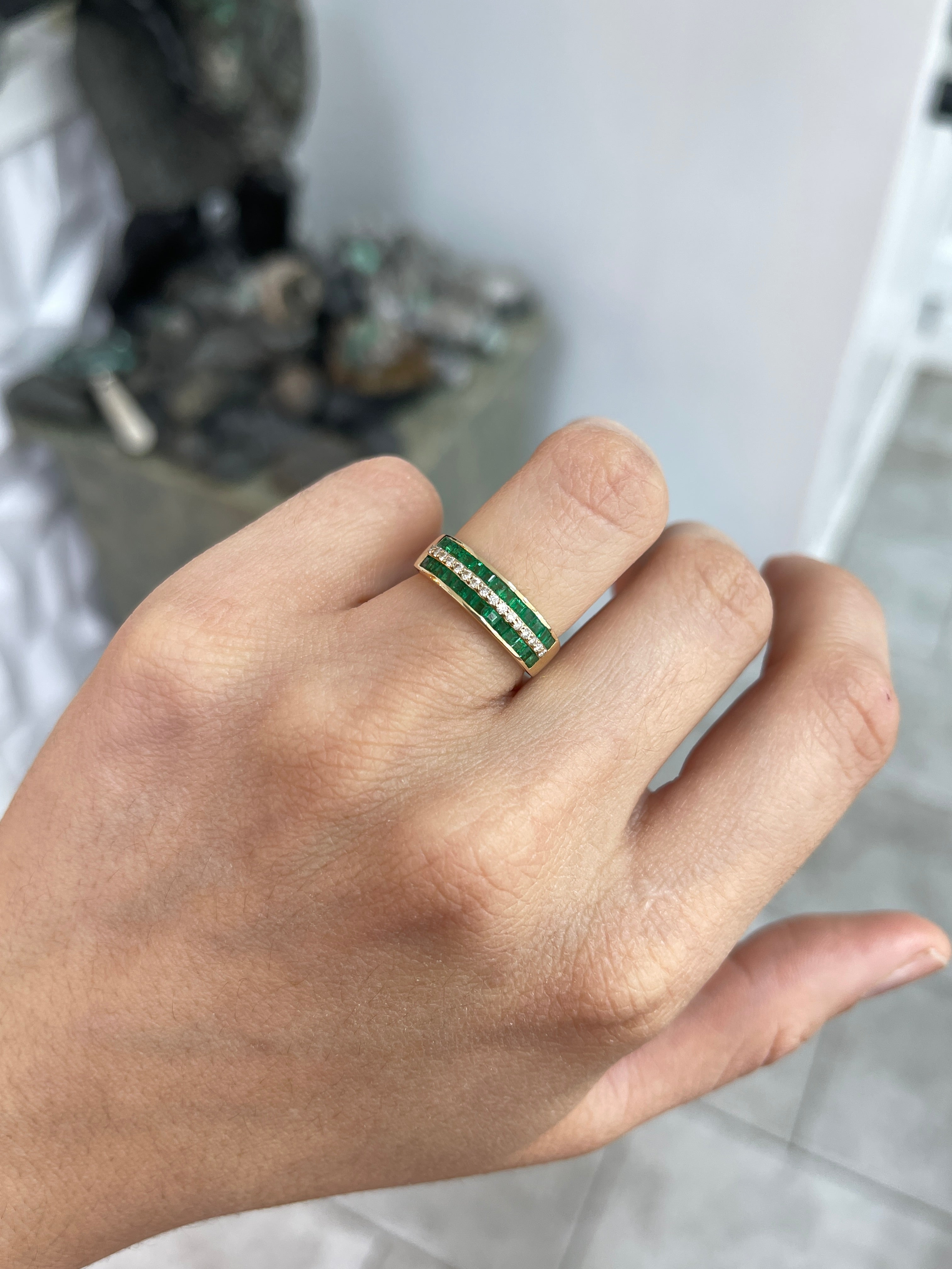 Three-row square emerald and diamond wedding band in 14K gold by JR Colombian Emeralds, showcasing intricate gemstone settings.