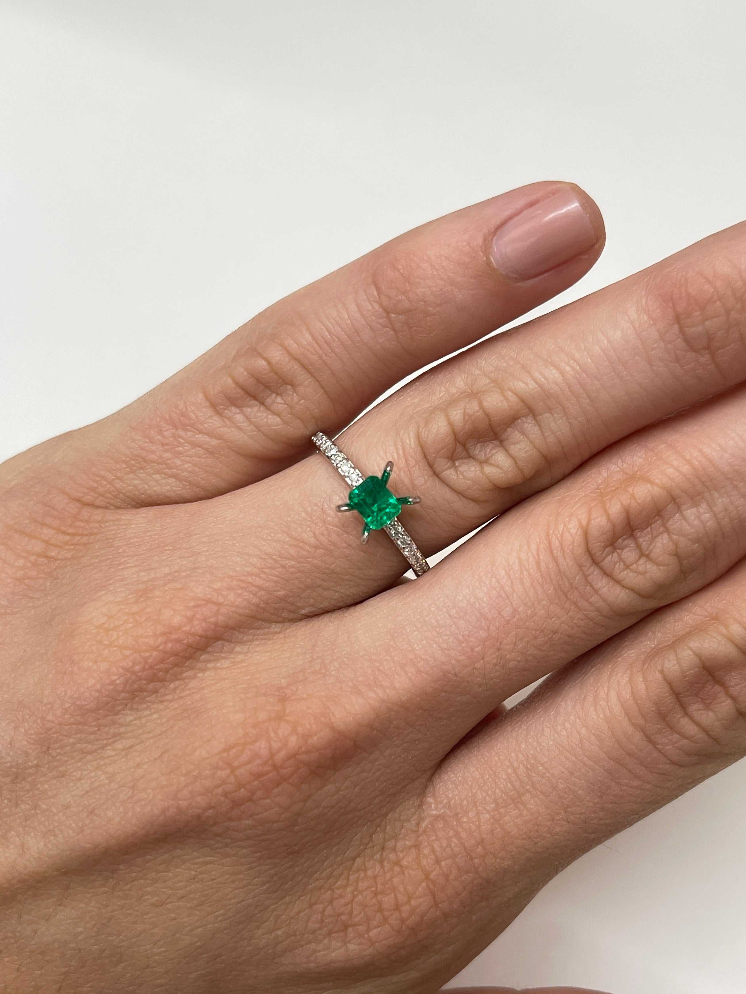 Loose 0.62 carat Colombian emerald cut gemstone with AAA+ quality, showcasing vibrant green color and clarity.