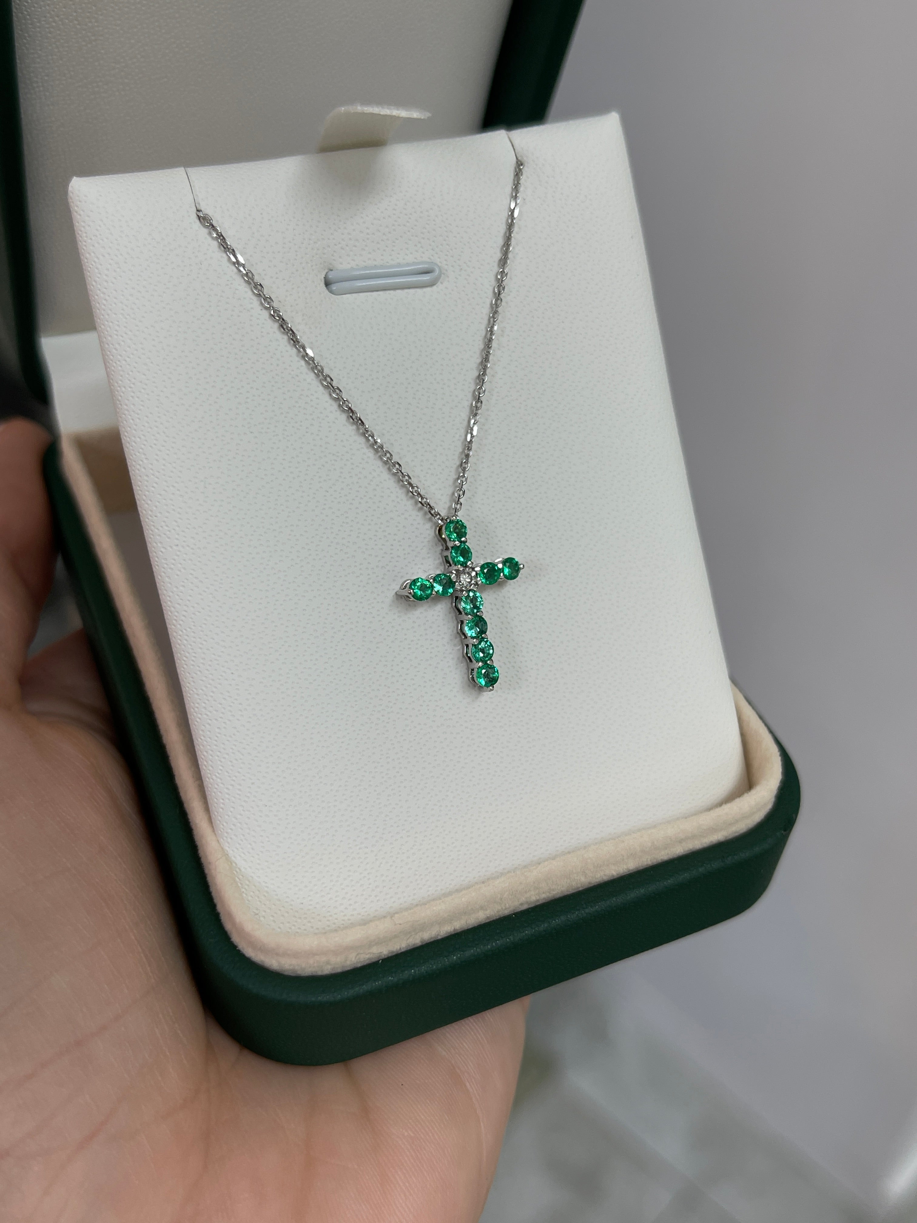 14K white gold cross necklace with 0.66 carats emerald and diamond accents, petite jewelry by JR Colombian Emeralds.