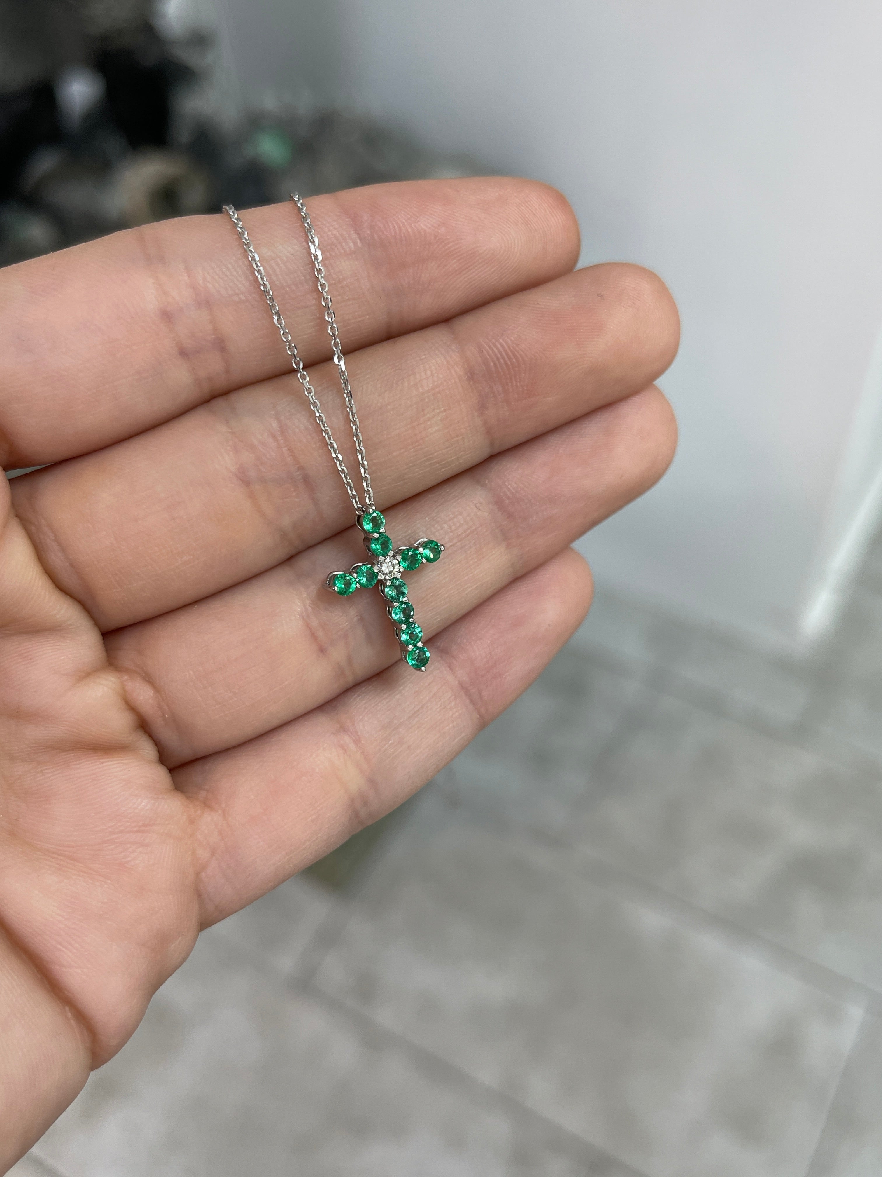 14K white gold cross necklace with 0.66tcw emerald and diamond accents, petite design, by JR Colombian Emeralds.