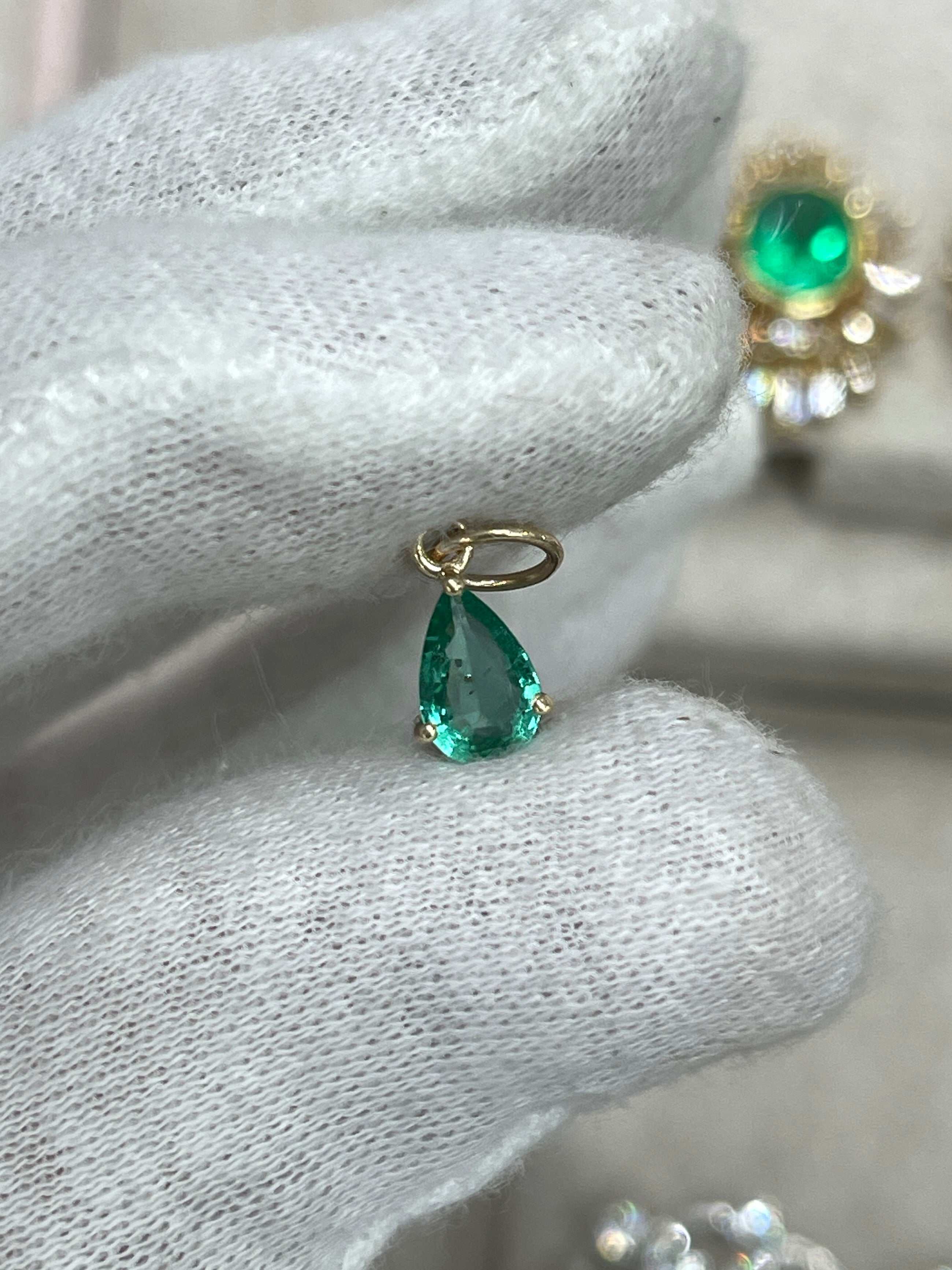Petite 0.70ct natural freckled teardrop emerald pendant in 14K prong setting by JR Colombian Emeralds