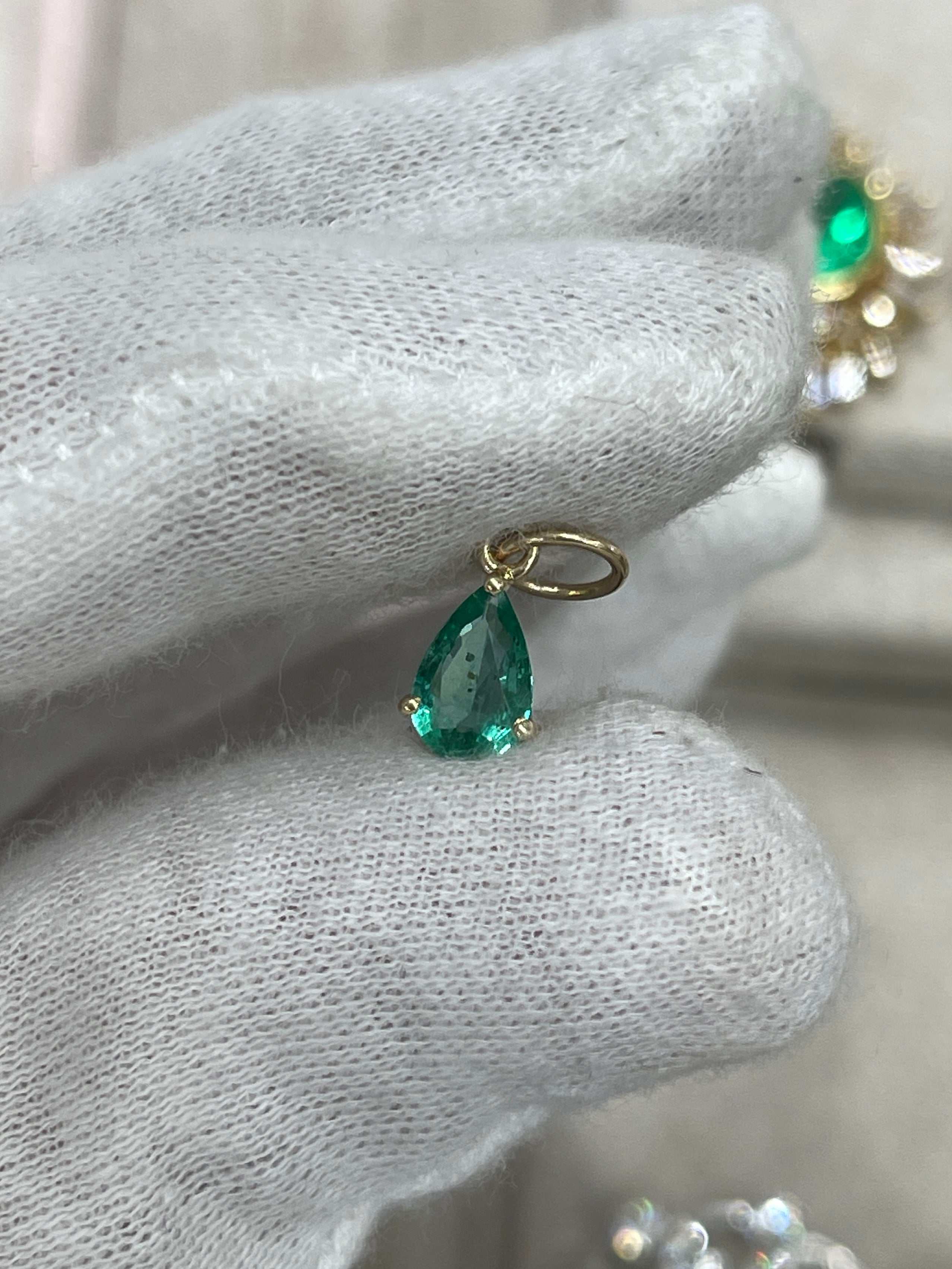 Petite 0.70ct natural freckled teardrop emerald pendant in 14K gold with prong setting, by JR Colombian Emeralds.