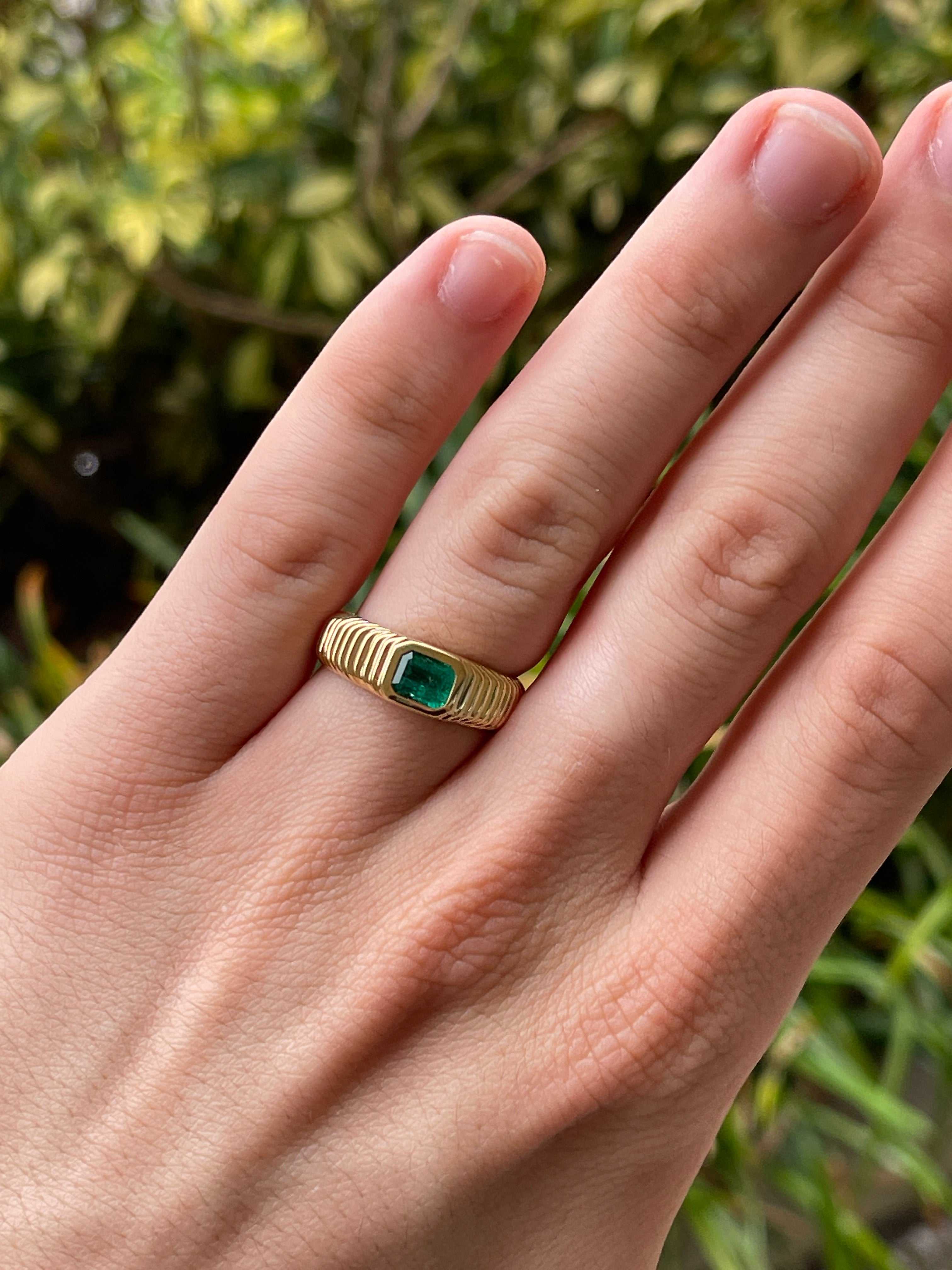 18K yellow gold men's ring with 0.81 carat Colombian emerald in a ribbed bezel setting, size 9, by JR Colombian Emeralds.