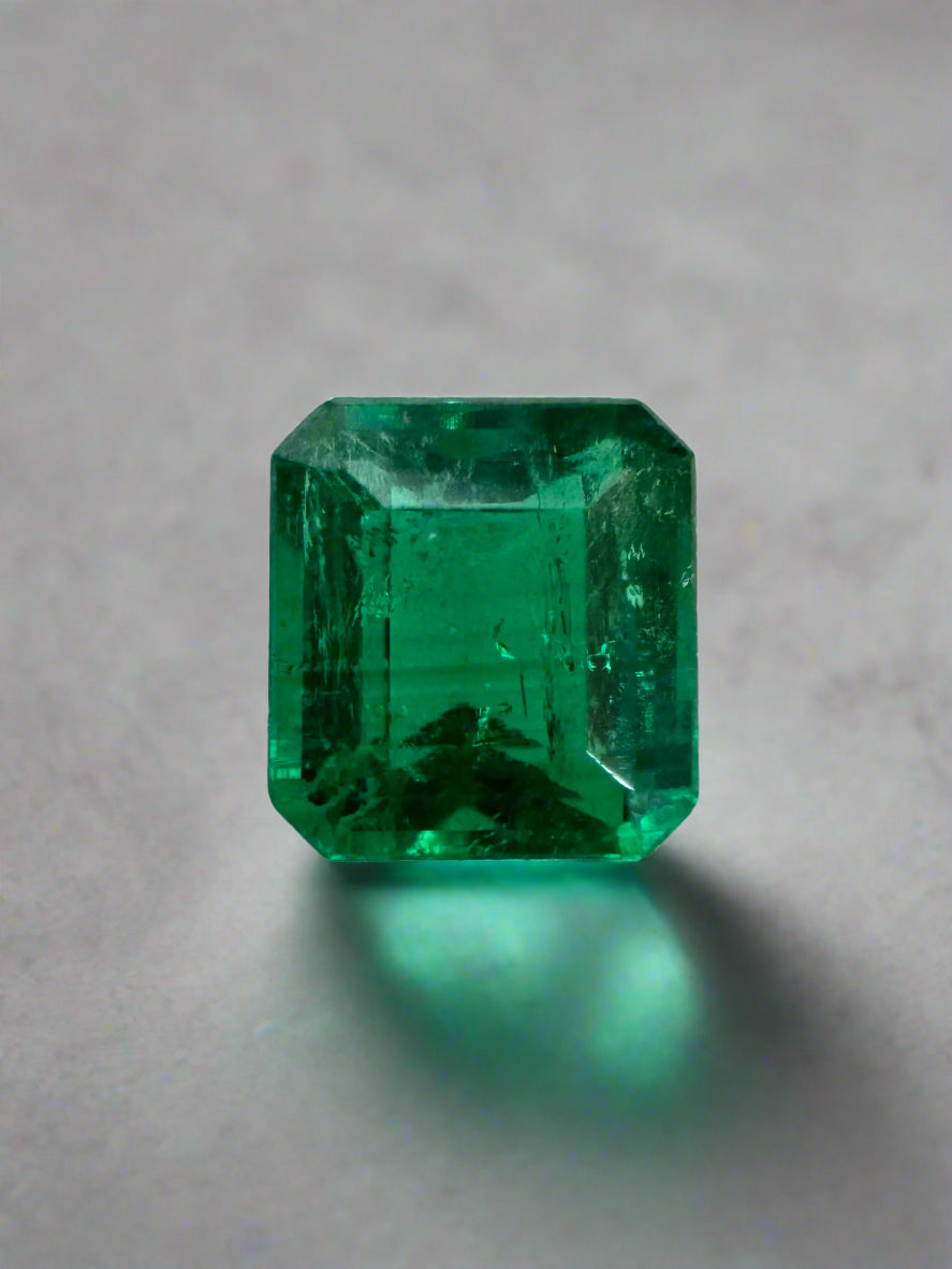 Loose 0.90 carat Colombian Emerald in AAA+ quality, Asscher cut, vibrant green gemstone from JR Colombian Emeralds.