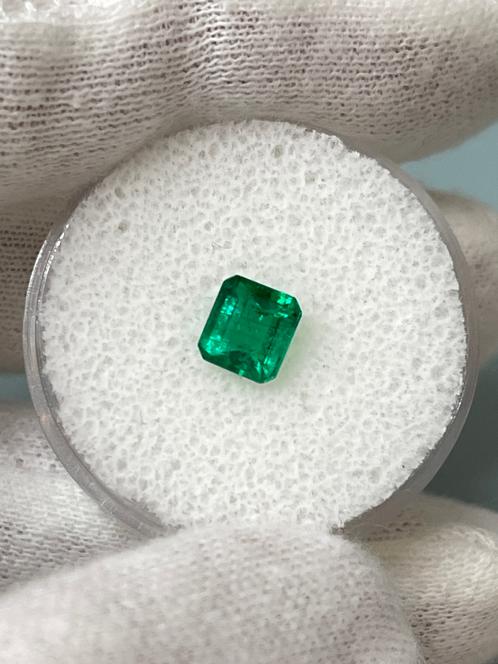 Loose 0.90 carat Colombian emerald in AAA+ quality, Asscher cut with vibrant green color and clarity, from JR Colombian Emeralds.