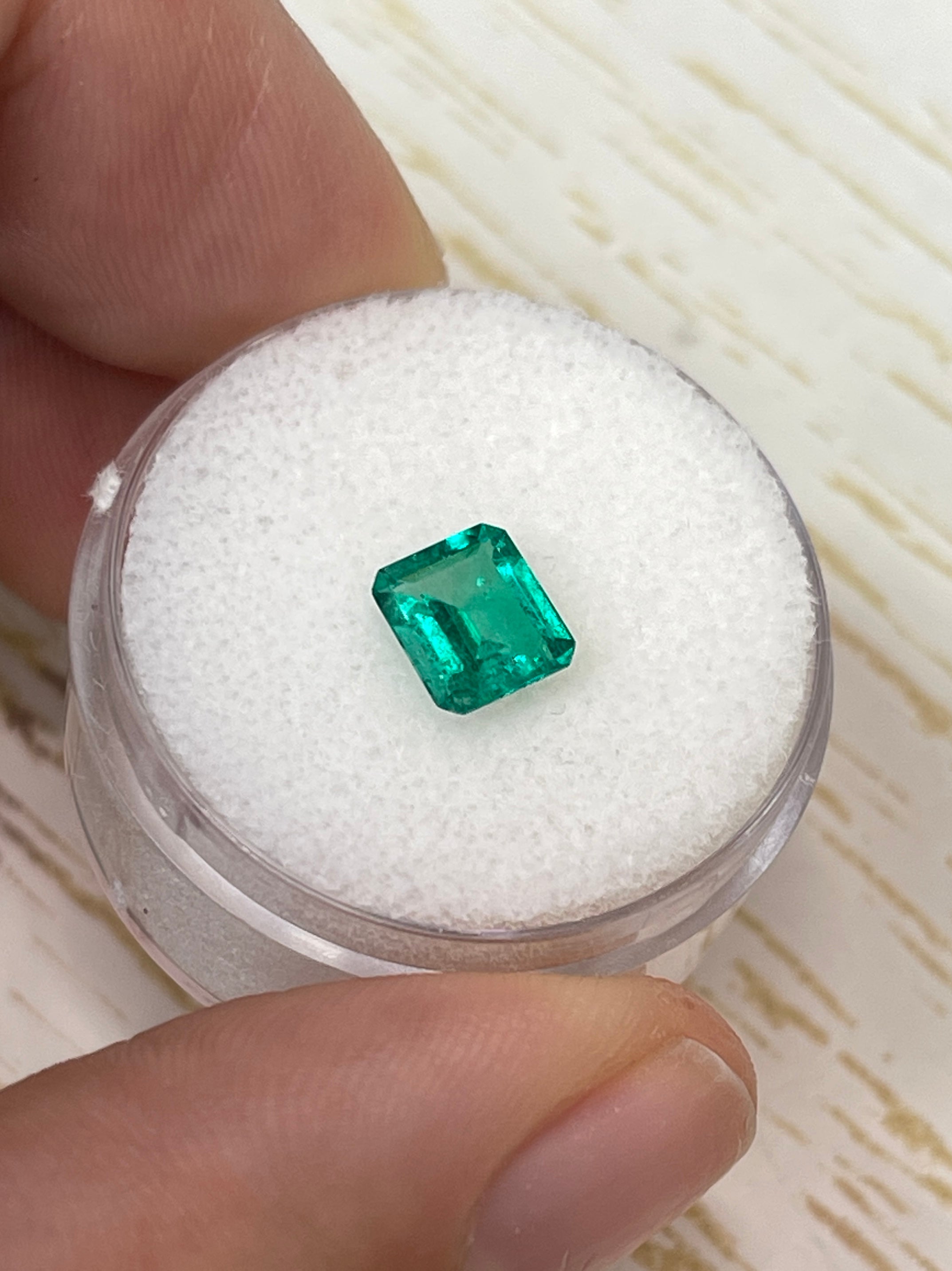 Vivid green 0.90 carat natural Colombian emerald loose gemstone in emerald cut, from JR Colombian Emeralds.