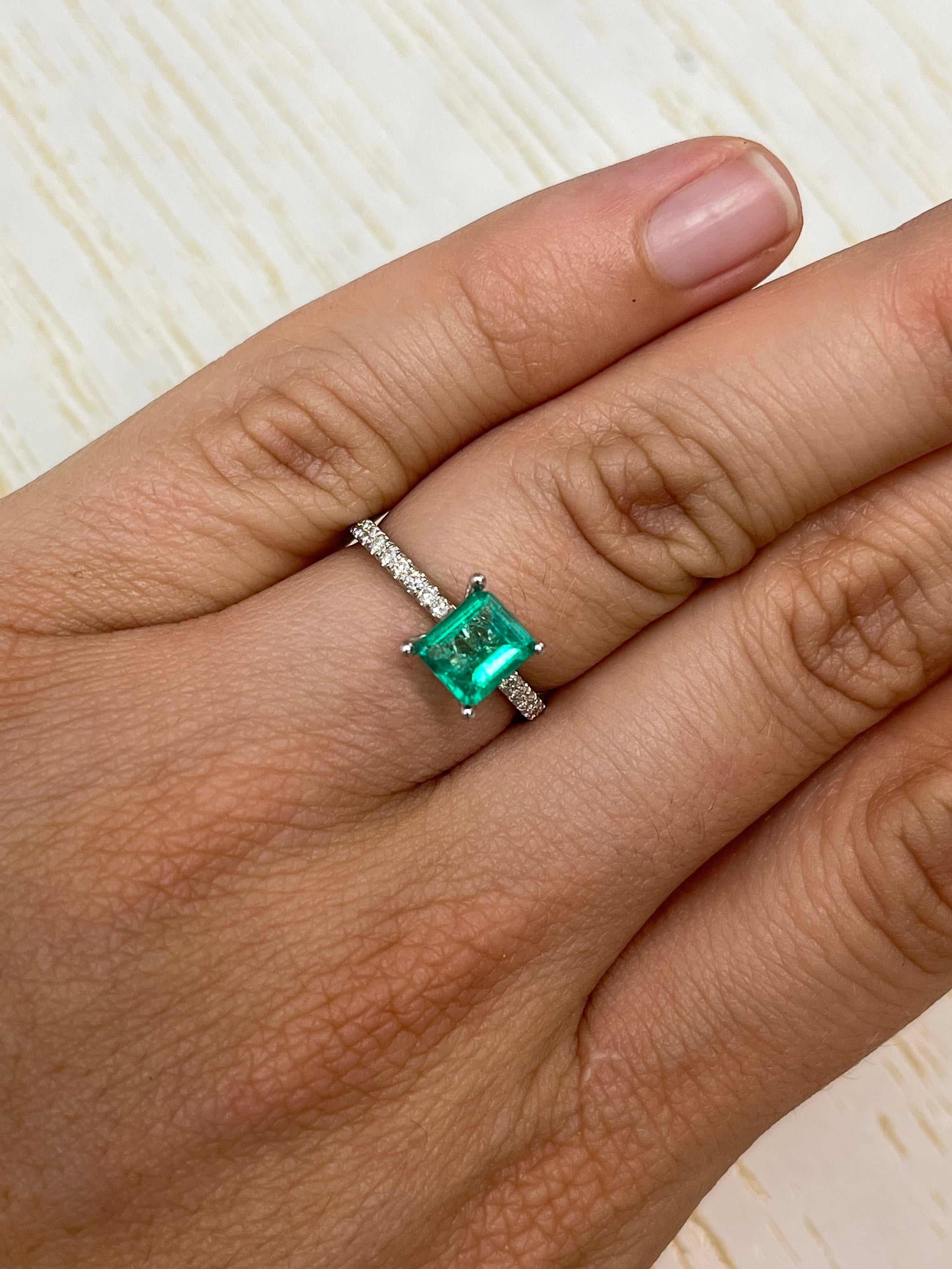 Vivid green 0.90 carat natural Colombian emerald loose gemstone in an emerald cut by JR Colombian Emeralds.
